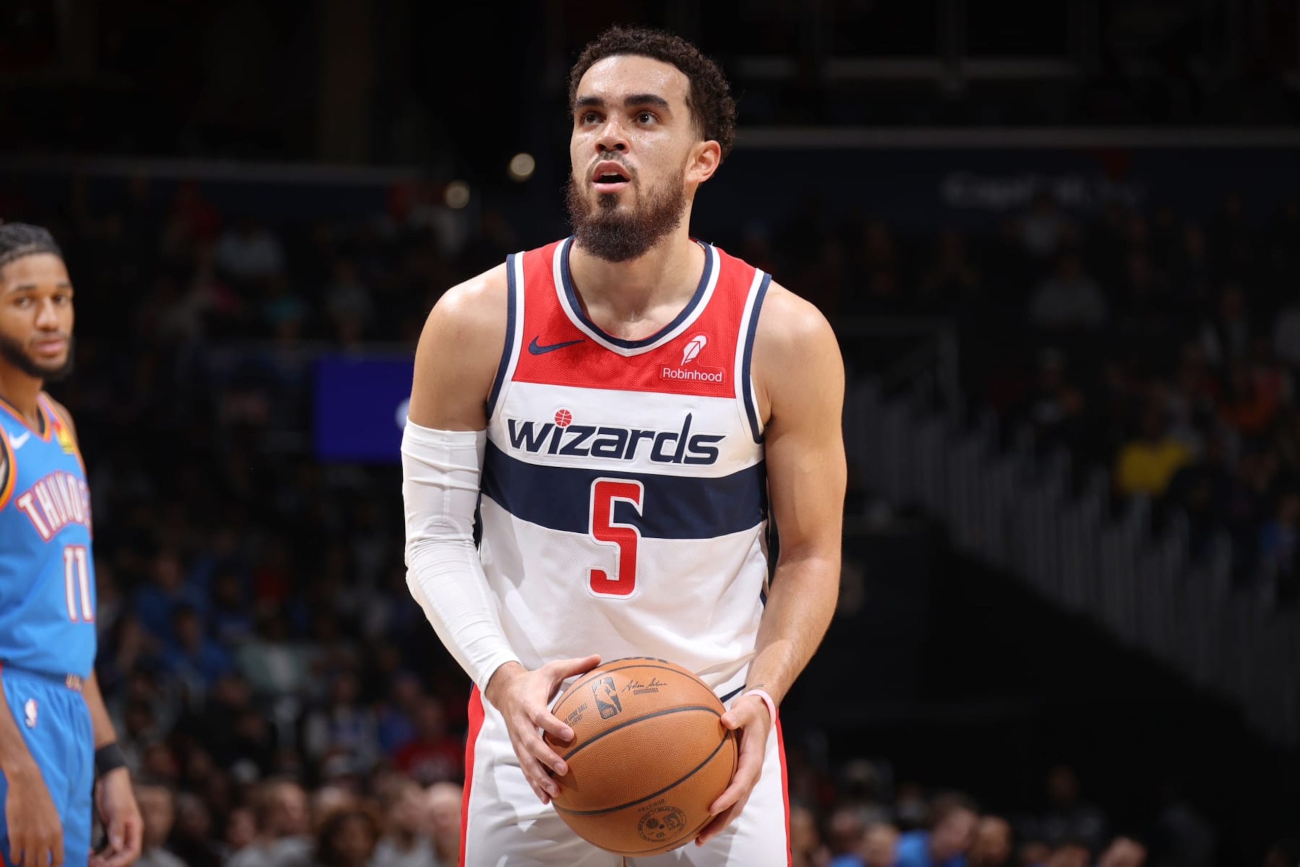 WASHINGTON, DC -  JANUARY 8: Tyus Jones #5 of the Washington Wizards shoots a free throw during the game against the Oklahoma City Thunder on January 8, 2024 at Capital One Arena in Washington, DC. NOTE TO USER: User expressly acknowledges and agrees that, by downloading and or using this Photograph, user is consenting to the terms and conditions of the Getty Images License Agreement. Mandatory Copyright Notice: Copyright 2024 NBAE (Photo by Stephen Gosling/NBAE via Getty Images)