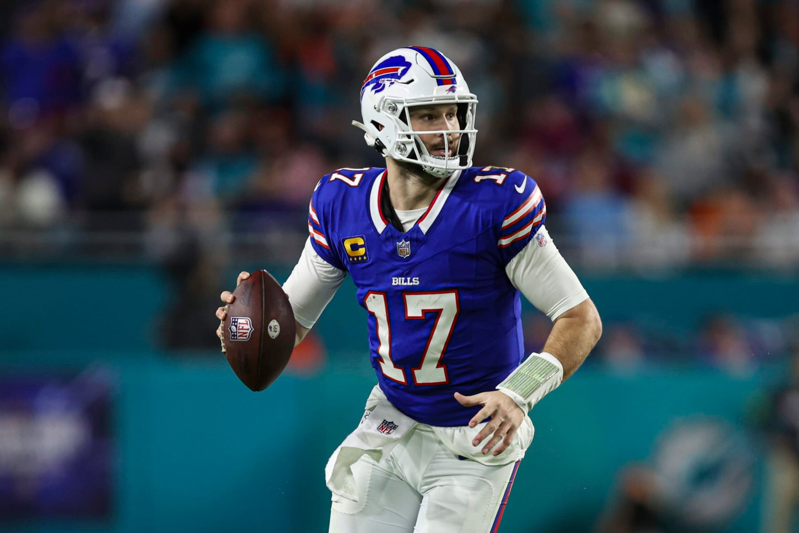 MIAMI GARDENS, FL - JANUARY 07: Josh Allen #17 of the Buffalo Bills scrambles out of the pocket during an NFL football game against the Miami Dolphins at Hard Rock Stadium on January 7, 2024 in Miami Gardens, Florida. (Photo by Perry Knotts/Getty Images)