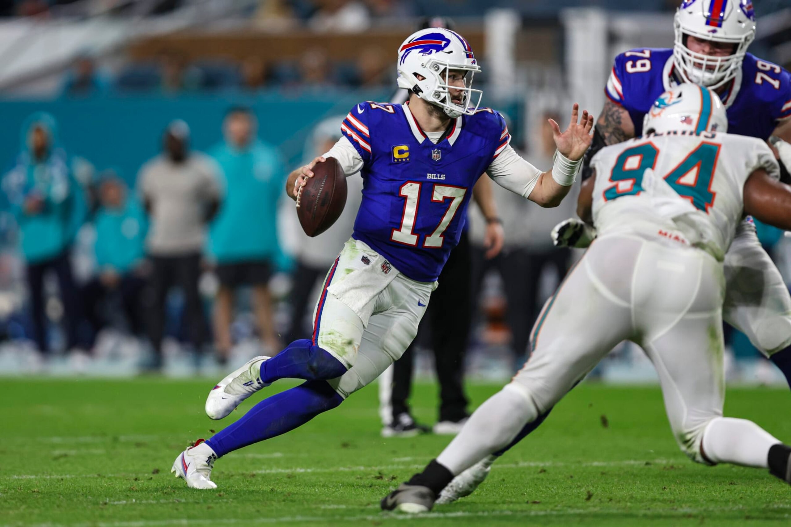 MIAMI GARDENS, FL - JANUARY 07: Josh Allen #17 of the Buffalo Bills scrambles out of the pocket during an NFL football game against the Miami Dolphins at Hard Rock Stadium on January 7, 2024 in Miami Gardens, Florida. (Photo by Perry Knotts/Getty Images)