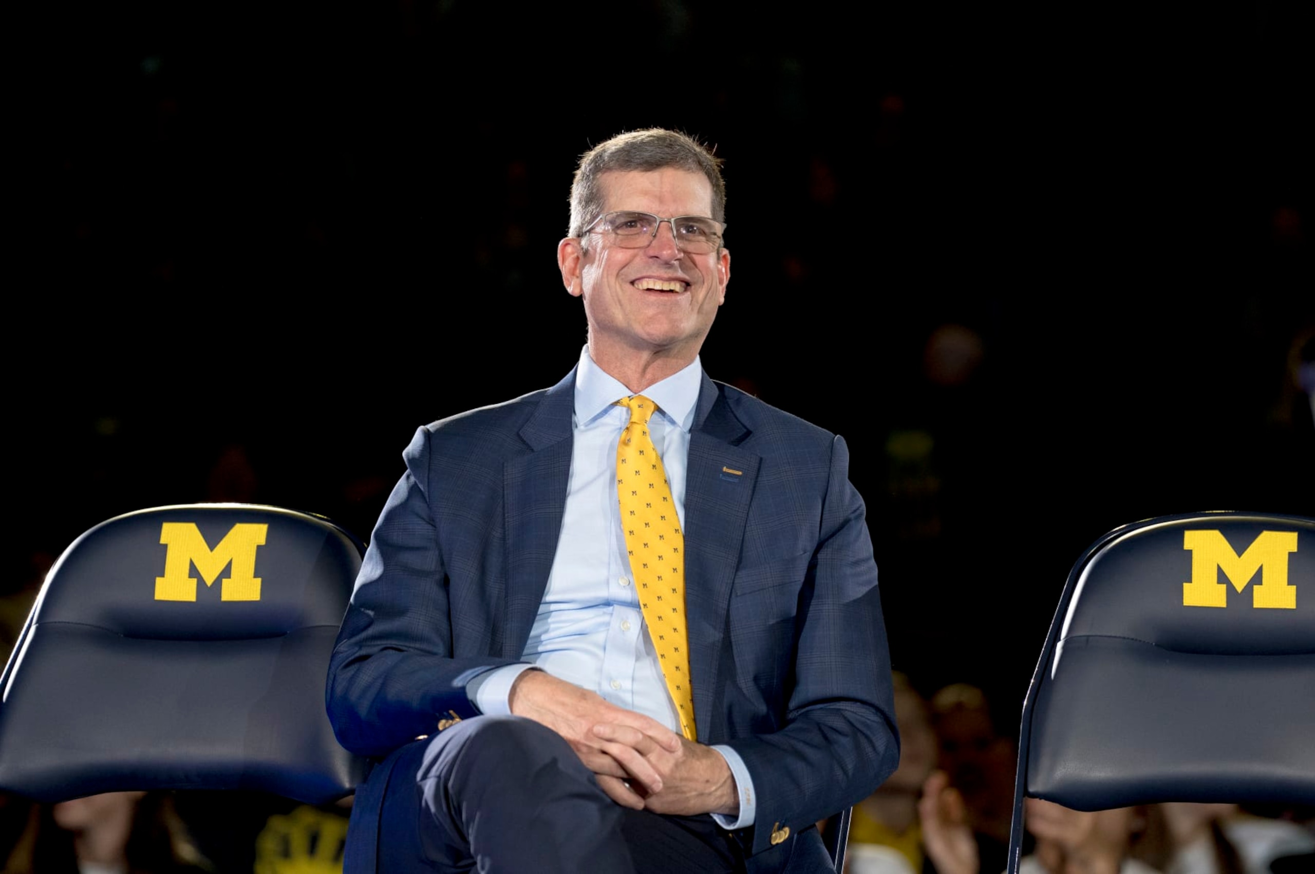 ANN ARBOR, MICHIGAN - JANUARY 13: Head coach Jim Harbaugh of the Michigan Wolverines smiles during the Michigan Wolverines football National Championship celebration on January 13, 2024 at Crisler Center in Ann Arbor, Michigan. (Photo by Nic Antaya/Getty Images)