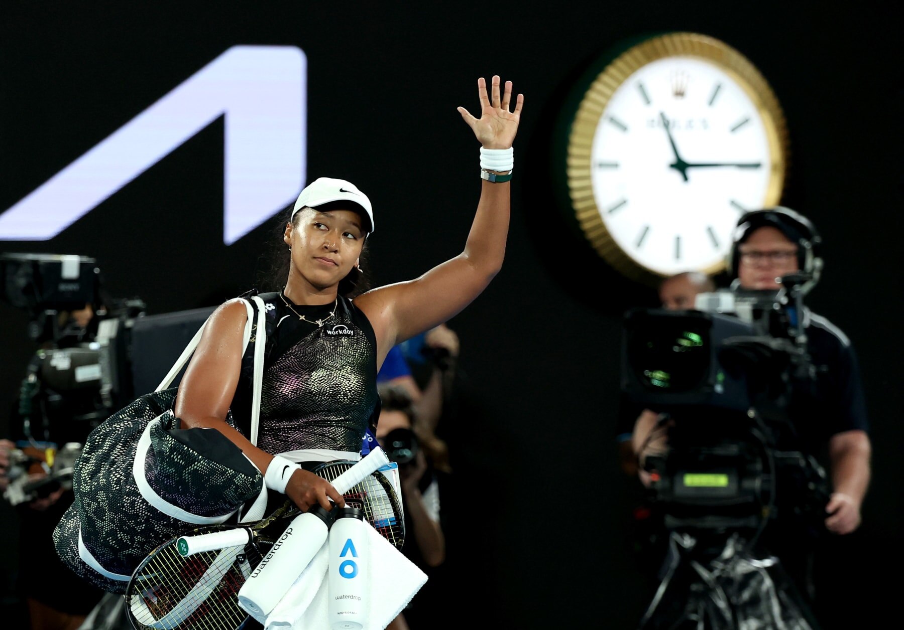 MELBOURNE, AUSTRALIA - JANUARY 15: Naomi Osaka of Japan acknowledges the fans after her loss in the round one singles match against Caroline Garcia of France during the 2024 Australian Open at Melbourne Park on January 15, 2024 in Melbourne, Australia. (Photo by Cameron Spencer/Getty Images)