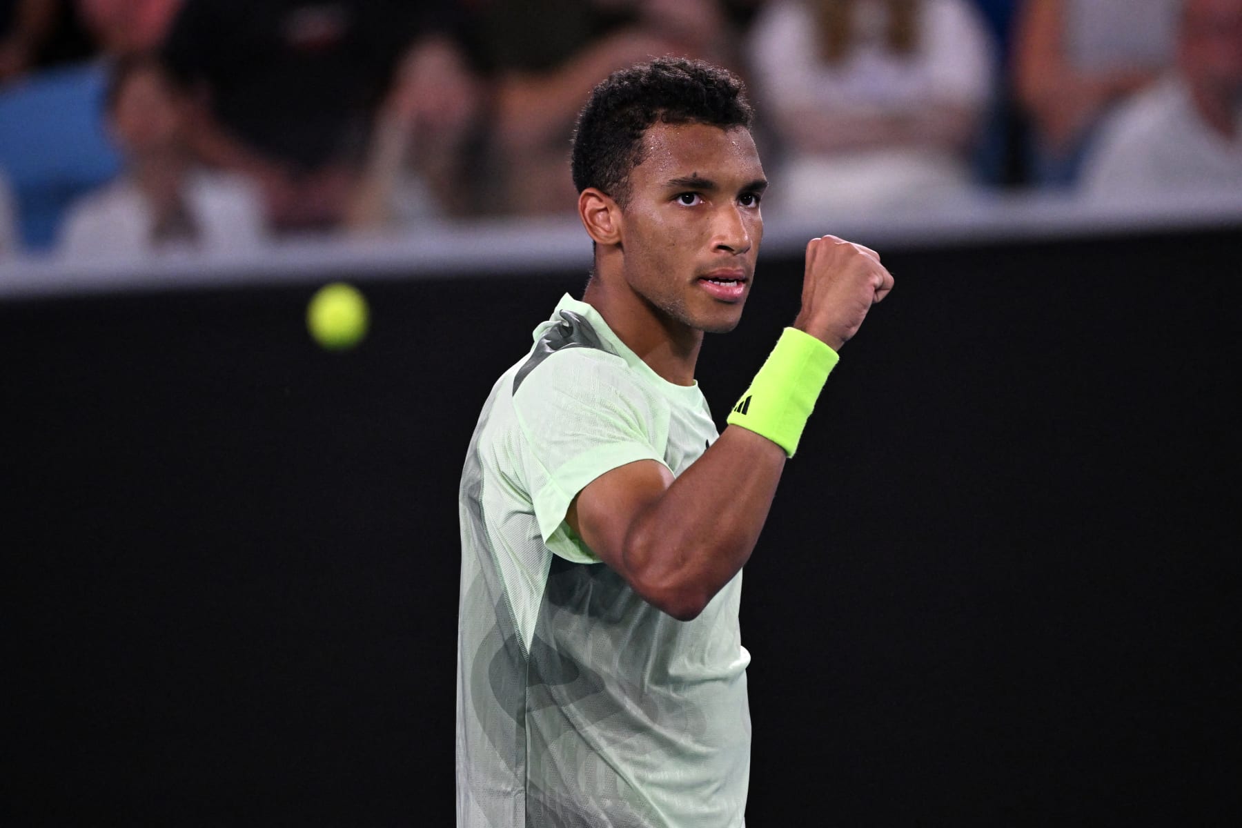 Canada's Felix Auger-Aliassime celebrates after winning the second set against Austria's Dominic Thiem during their men's singles match on day two of the Australian Open tennis tournament in Melbourne on January 15, 2024. (Photo by WILLIAM WEST / AFP) / -- IMAGE RESTRICTED TO EDITORIAL USE - STRICTLY NO COMMERCIAL USE -- (Photo by WILLIAM WEST/AFP via Getty Images)