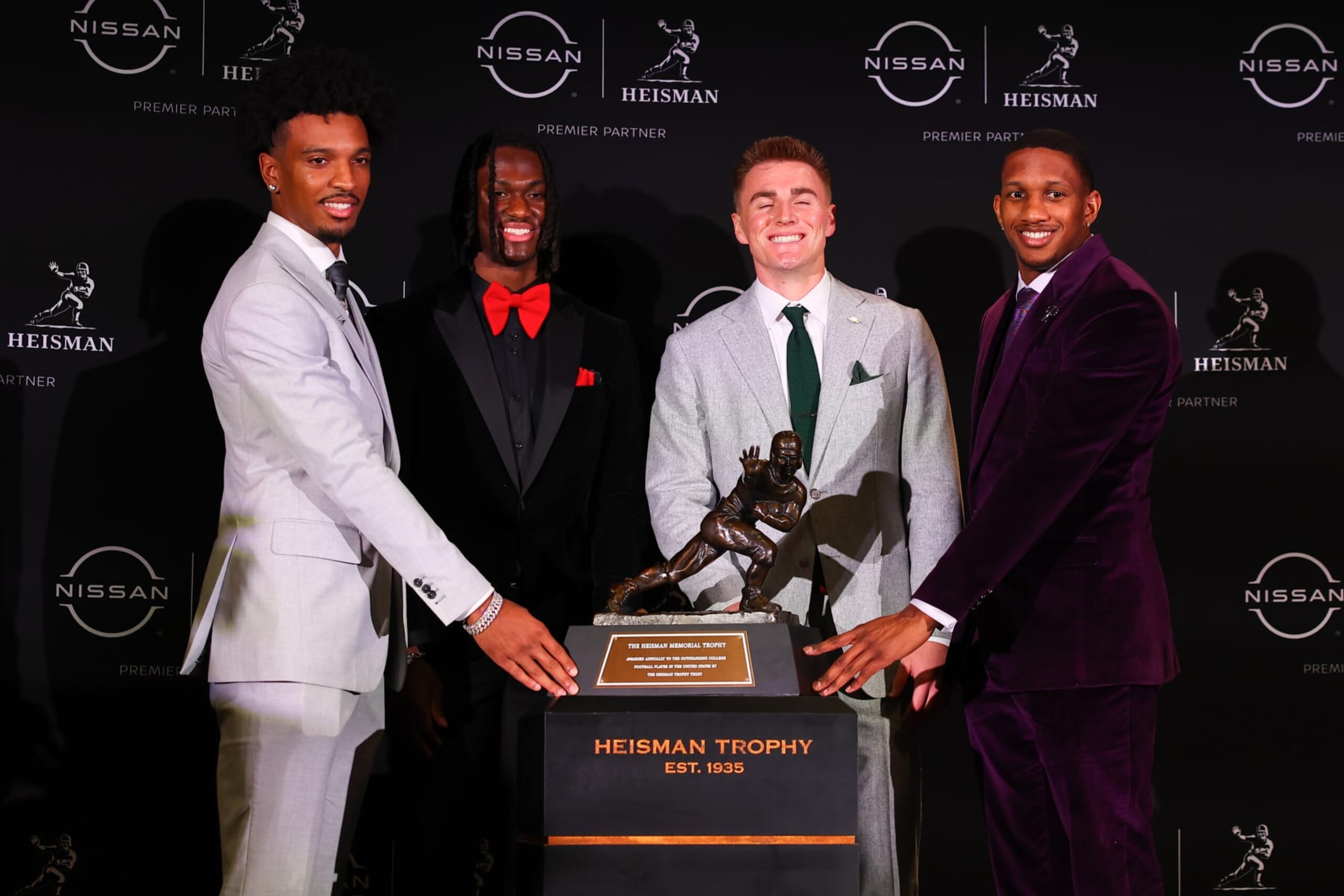 Jayden Daniels (left), Bo Nix (middle right) and Michael Penix Jr. (right) with Marvin Harrison Jr. (middle left) Jayden Daniels (left), Bo Nix (middle right) and Michael Penix Jr. (right) with Marvin Harrison Jr. (middle left)