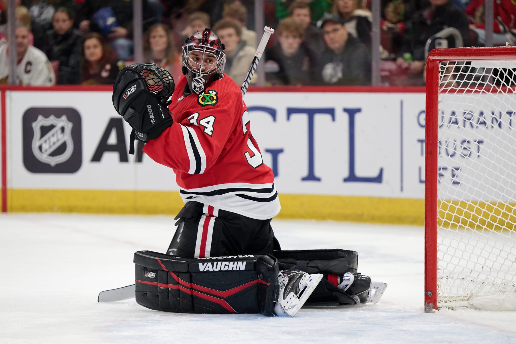 CHICAGO, ILLINOIS - JANUARY 07:  Goaltender Petr Mrazek #34 of the Chicago Blackhawks defends the net against against the Calgary Flames on January 07, 2024 at United Center in Chicago, Illinois.  (Photo by Jamie Sabau/Getty Images)