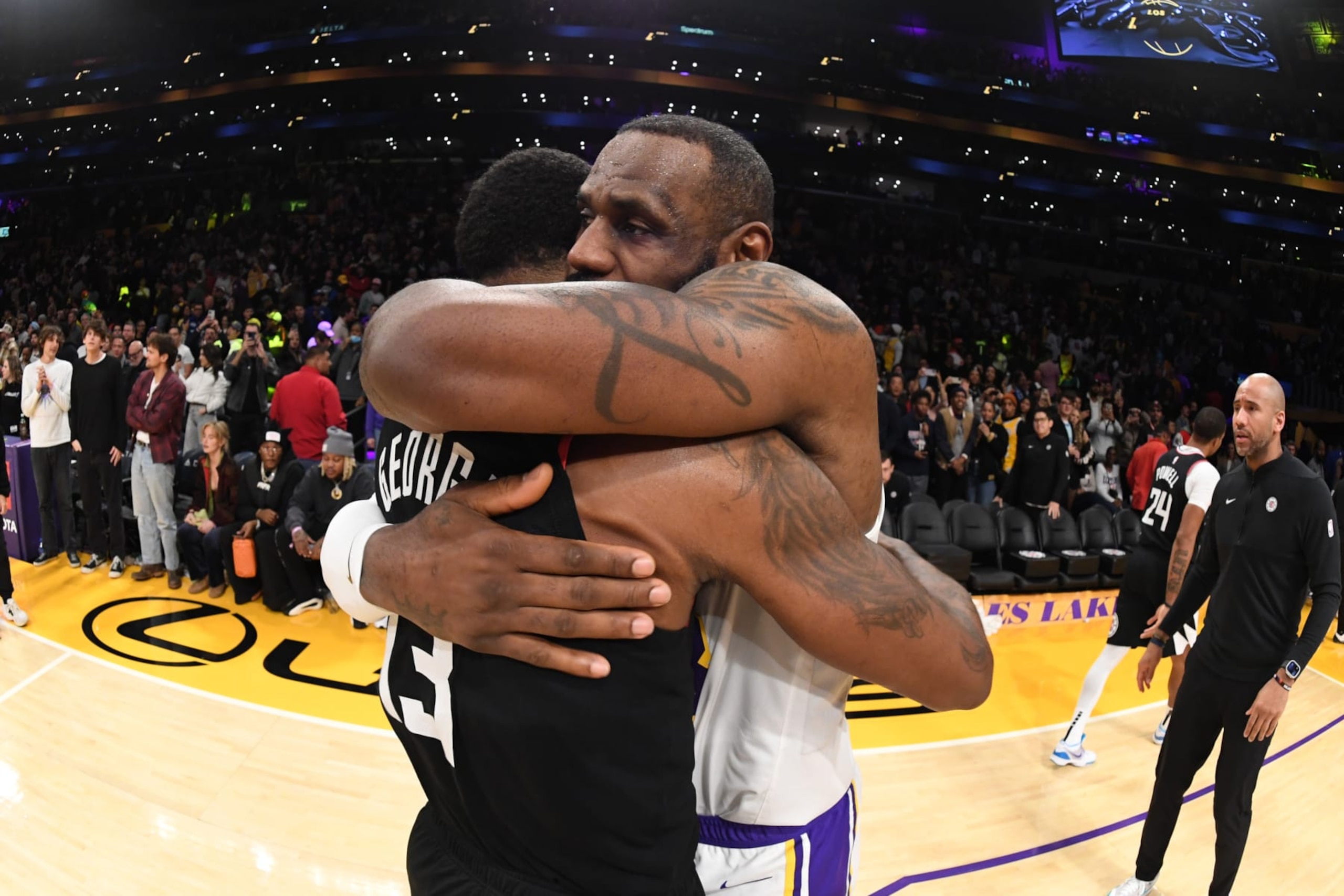 LOS ANGELES, CA - JANUARY 7: LeBron James #23 of the Los Angeles Lakers hugs Paul George #13 of the LA Clippers after the game on January 7, 2024 at Crypto.Com Arena in Los Angeles, California. NOTE TO USER: User expressly acknowledges and agrees that, by downloading and/or using this Photograph, user is consenting to the terms and conditions of the Getty Images License Agreement. Mandatory Copyright Notice: Copyright 2024 NBAE (Photo by Andrew D. Bernstein/NBAE via Getty Images)