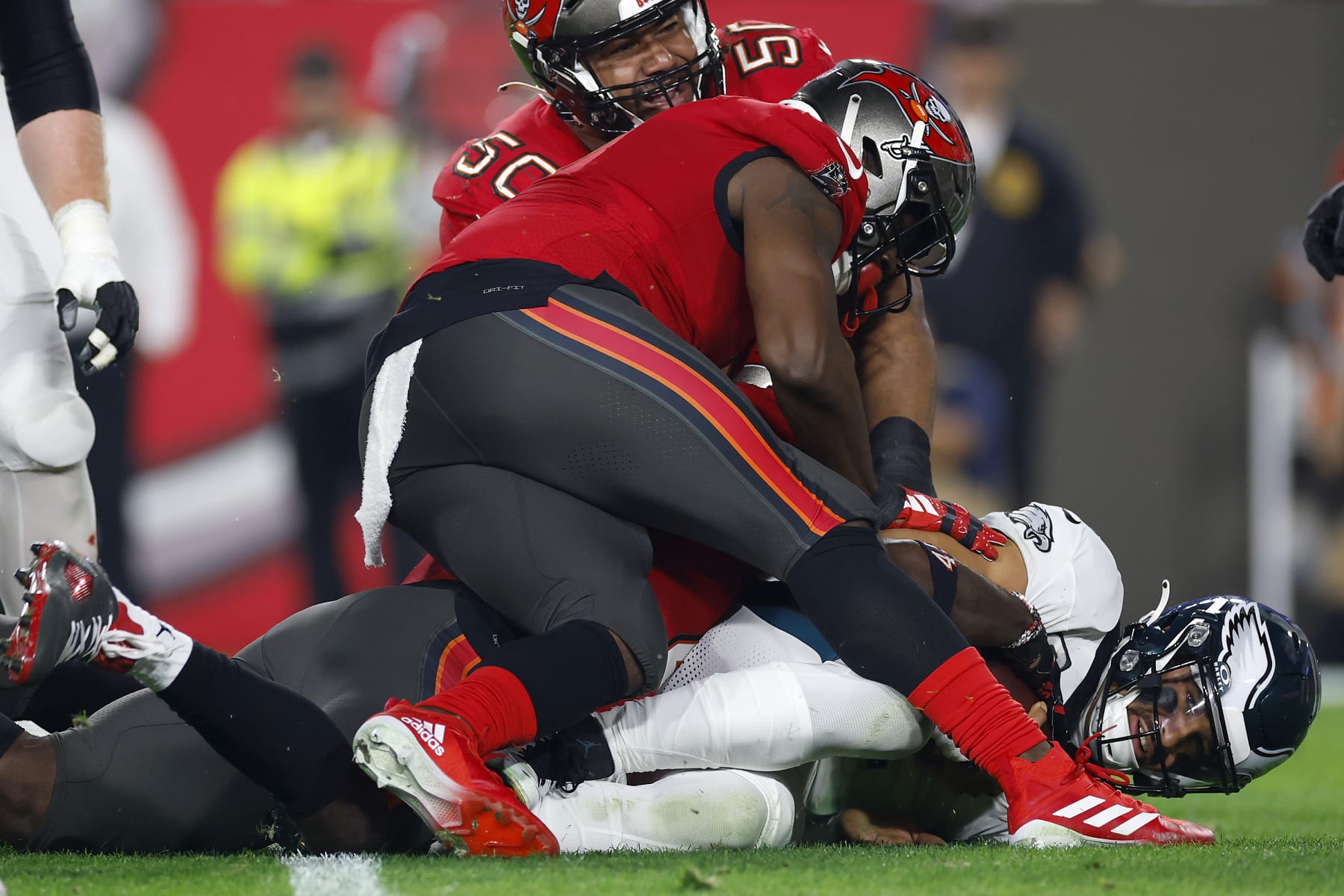 TAMPA, FLORIDA - JANUARY 15: Calijah Kancey #94 of the Tampa Bay Buccaneers sacks Jalen Hurts #1 of the Philadelphia Eagles during the third quarter in the NFC Wild Card Playoffs at Raymond James Stadium on January 15, 2024 in Tampa, Florida. (Photo by Mike Ehrmann/Getty Images)