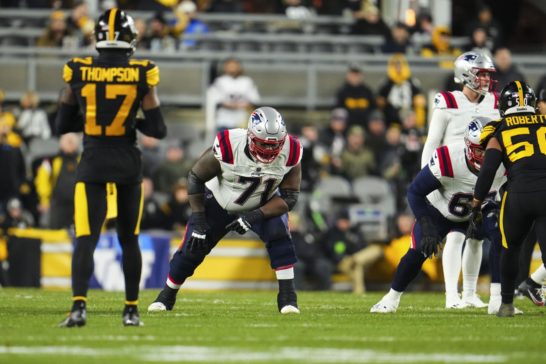 PITTSBURGH, PA - DECEMBER 07: Mike Onwenu #71 of the New England Patriots lines up during an NFL football game against the Pittsburgh Steelers at Acrisure Stadium on December 7, 2023 in Pittsburgh, Pennsylvania. (Photo by Cooper Neill/Getty Images)