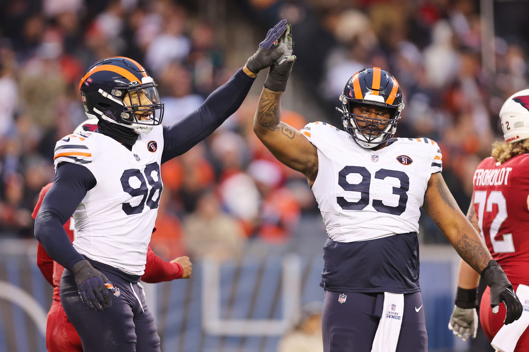 CHICAGO, ILLINOIS - DECEMBER 24: Montez Sweat #98 and Justin Jones #93 of the Chicago Bears celebrate a block during the second quarter against the Arizona Cardinals at Soldier Field on December 24, 2023 in Chicago, Illinois. (Photo by Michael Reaves/Getty Images)
