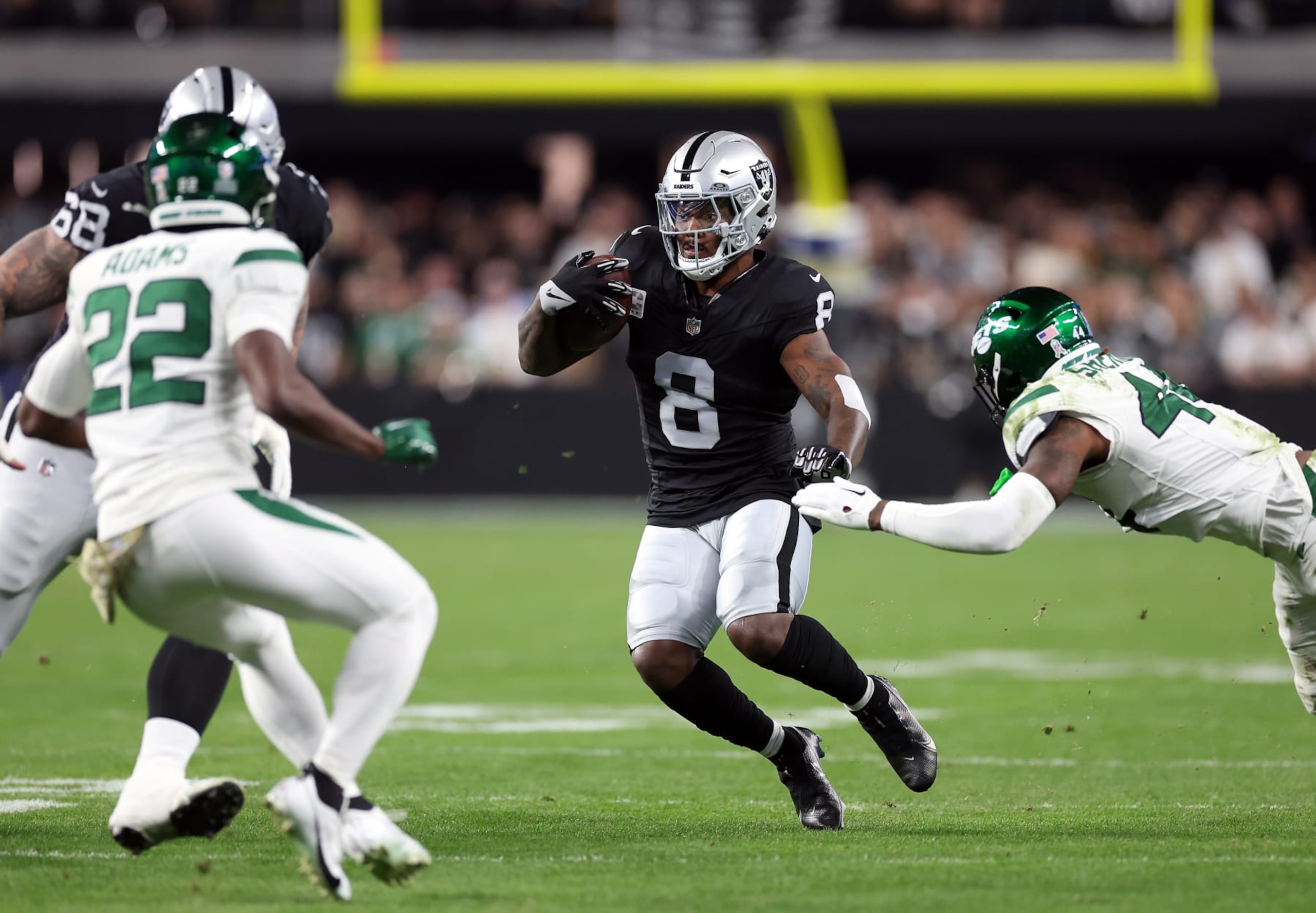 LAS VEGAS, NEVADA - NOVEMBER 12:  Running back Josh Jacobs #8 of the Las Vegas Raiders carries the ball after making a catch during the 1st quarter of the game against the New York Jets at Allegiant Stadium on November 12, 2023 in Las Vegas, Nevada. (Photo by Sean M. Haffey/Getty Images)