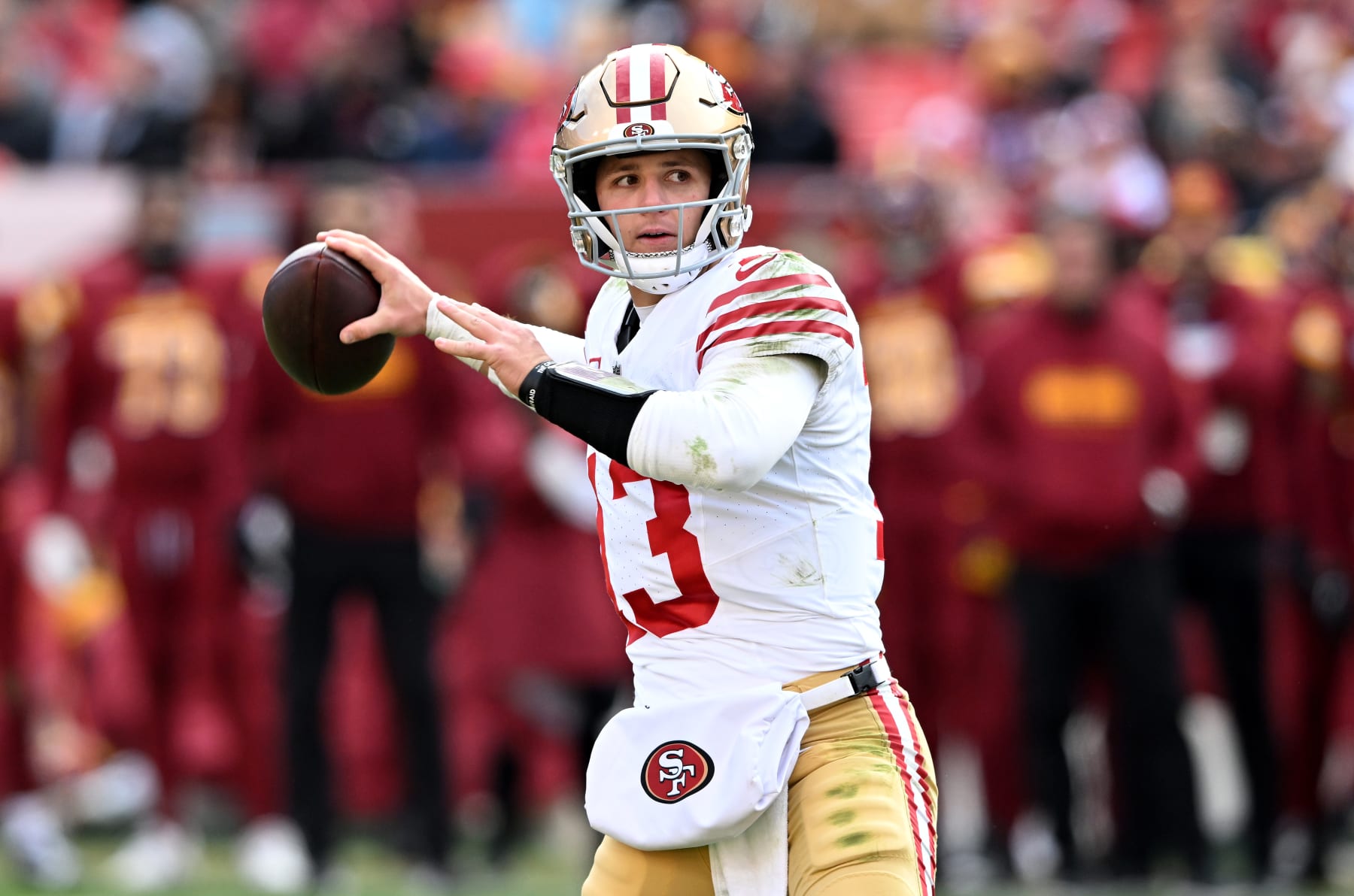LANDOVER, MARYLAND - DECEMBER 31: Brock Purdy #13 of the San Francisco 49ers throws a pass against the Washington Commanders at FedExField on December 31, 2023 in Landover, Maryland. (Photo by G Fiume/Getty Images)