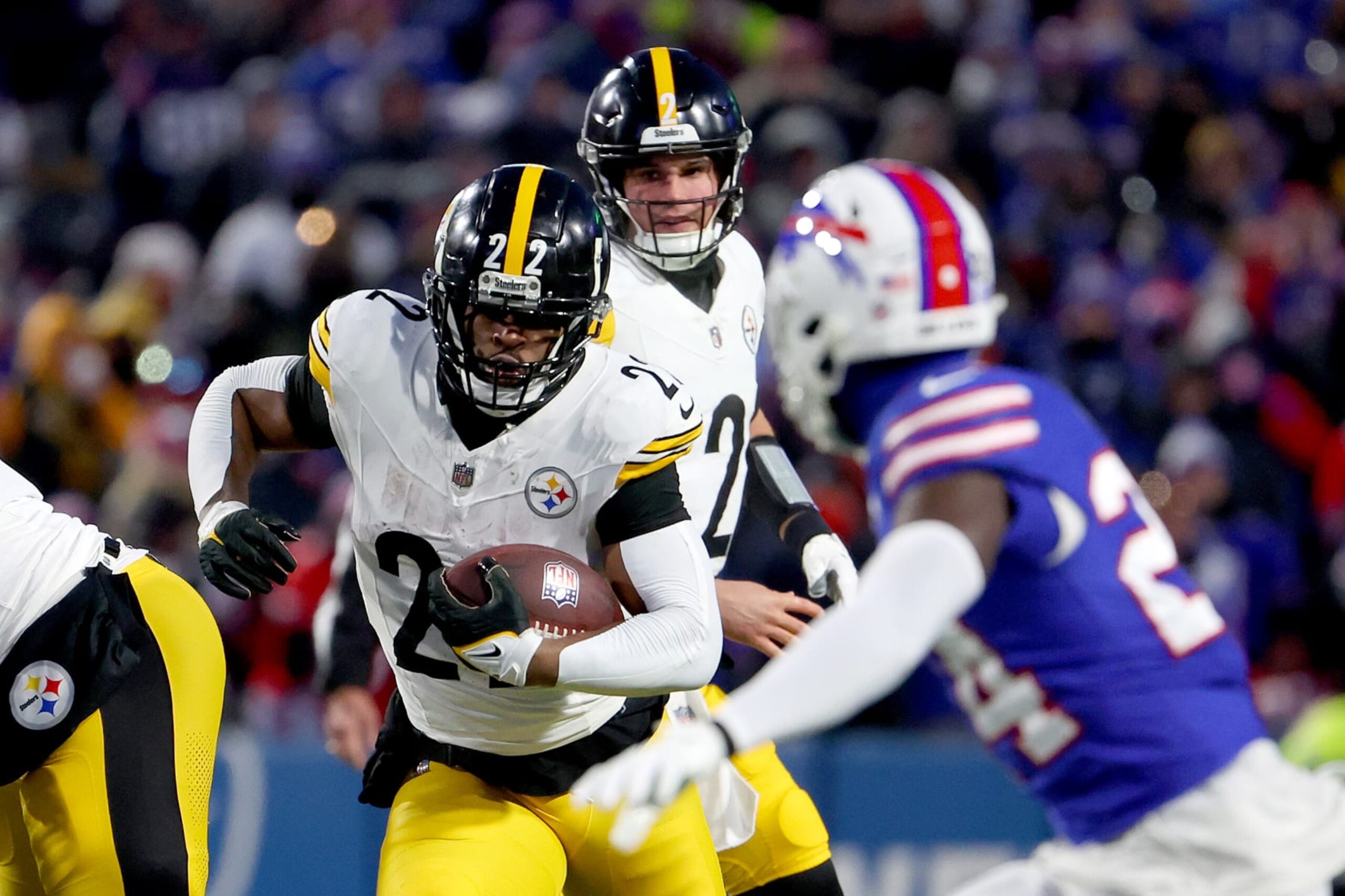 ORCHARD PARK, NEW YORK - JANUARY 15: Najee Harris #22 of the Pittsburgh Steelers carries the ball against the Buffalo Bills during the first quarter at Highmark Stadium on January 15, 2024 in Orchard Park, New York. (Photo by Timothy T Ludwig/Getty Images)