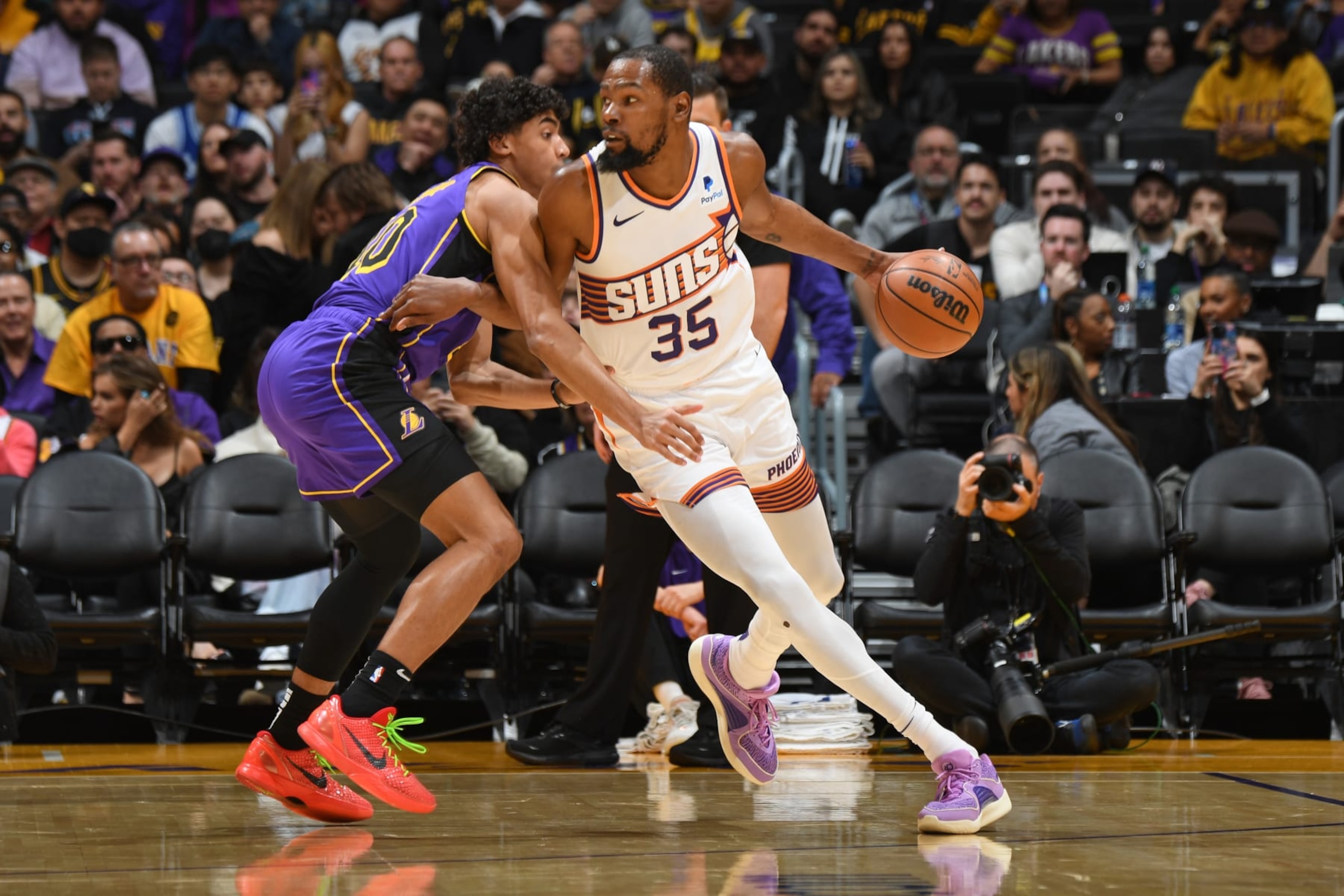 LOS ANGELES, CA - JANUARY 11:  Kevin Durant #35 of the Phoenix Suns handles the ball during the game against the Phoenix Suns on January 11, 2024 at Crypto.Com Arena in Los Angeles, California. NOTE TO USER: User expressly acknowledges and agrees that, by downloading and/or using this Photograph, user is consenting to the terms and conditions of the Getty Images License Agreement. Mandatory Copyright Notice: Copyright 2024 NBAE (Photo by Andrew D. Bernstein/NBAE via Getty Images)