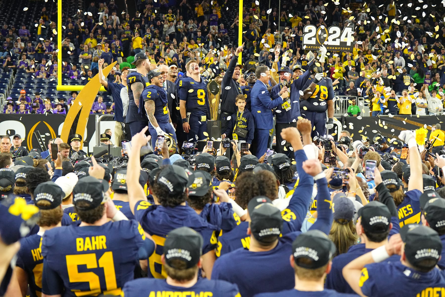 College Football: CFP National Championship: Michigan head coach Jim harbaugh and dad Jack Harbaugh victorious following victory vs Washington at NRG Stadium. 
Houston, TX 1/8/2024
CREDIT: Erick W. Rasco (Photo by Erick W. Rasco/Sports Illustrated via Getty Images) 
(Set Number: X164476 TK1)