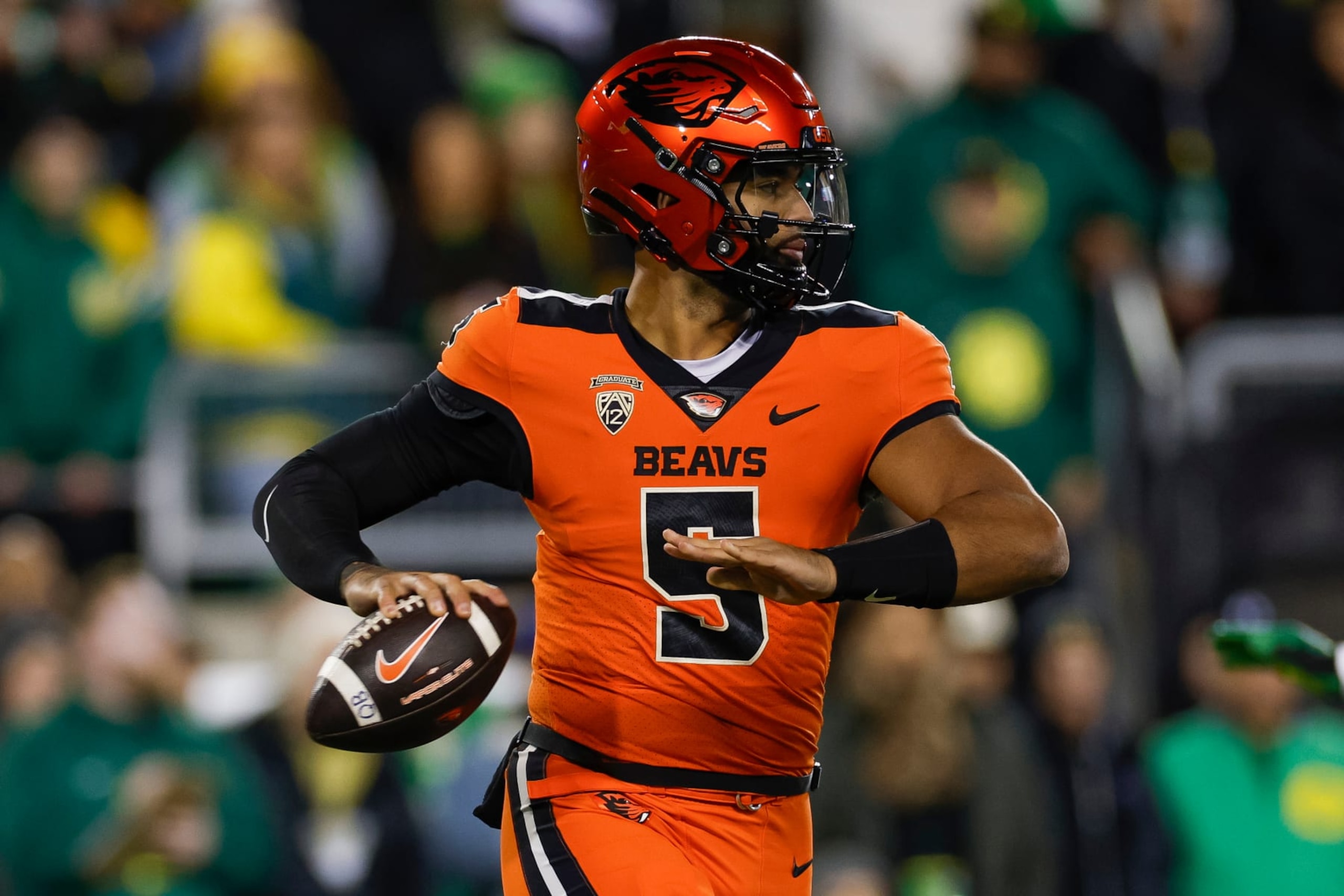 EUGENE, OREGON - NOVEMBER 24: DJ Uiagalelei #5 of the Oregon State Beavers passes the ball in the first half during a game against the Oregon Ducks at Autzen Stadium on November 24, 2023 in Eugene, Oregon. (Photo by Brandon Sloter/Image Of Sport/Getty Images)