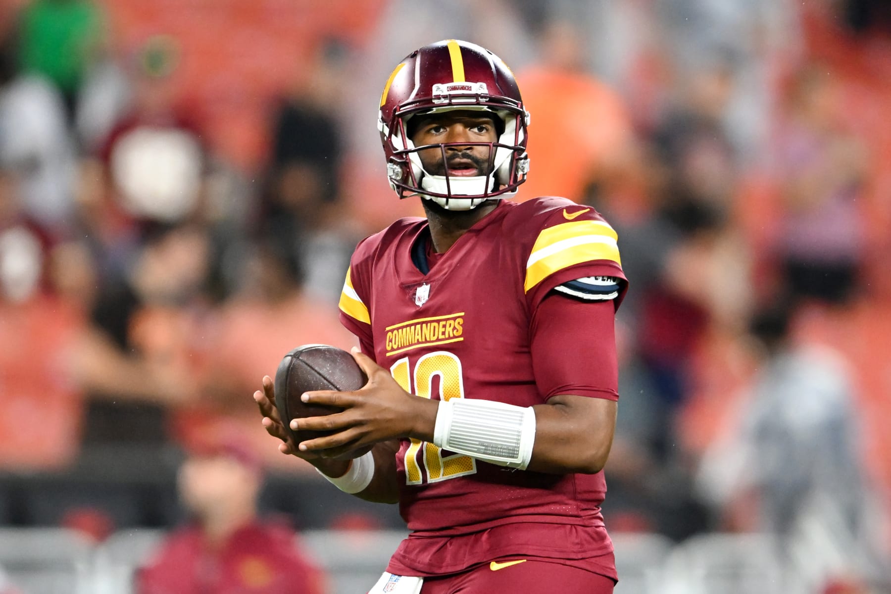 CLEVELAND, OHIO - AUGUST 11: Jacoby Brissett #12 of the Washington Commanders warms up prior to a preseason game against the Cleveland Browns at Cleveland Browns Stadium on August 11, 2023 in Cleveland, Ohio. (Photo by Nick Cammett/Diamond Images via Getty Images)