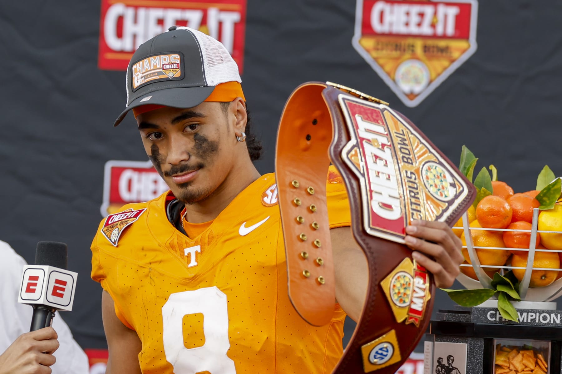 ORLANDO, FL - JANUARY 01: Tennessee Volunteers quarterback Nico Iamaleava (8) holds the award for the MVP of the game after the game between the Tennessee Volunteers and the Iowa Hawkeyes on January 1, 2024 at Camping World Stadium in Orlando, Fl. (Photo by David Rosenblum/Icon Sportswire via Getty Images)