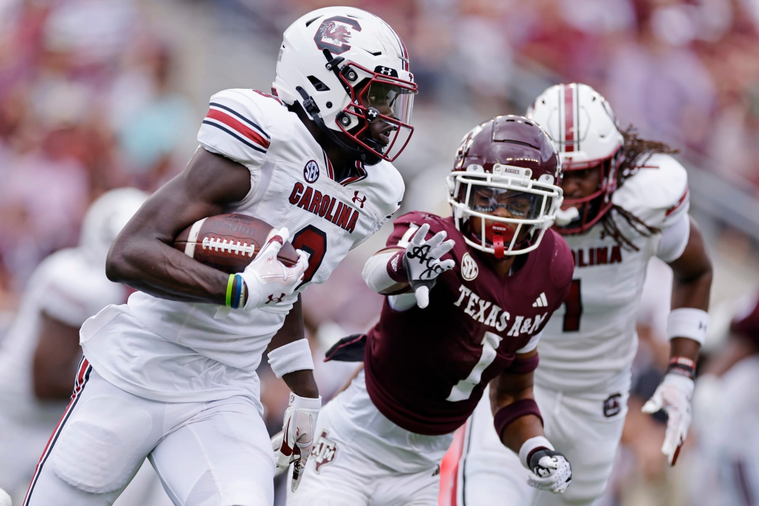 COLLEGE STATION, TX - OCTOBER 28: South Carolina Gamecocks wide receiver Nyck Harbor (8) runs with the ball while pursued by Texas A&M Aggies defensive back Bryce Anderson (1) during a college football game on October 28, 2023 at Kyle Field in College Station, Texas. (Photo by Joe Robbins/Icon Sportswire via Getty Images)