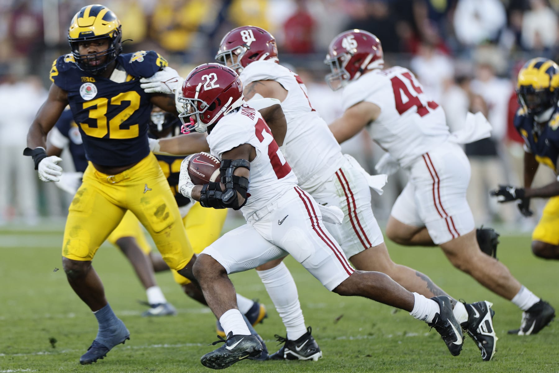 PASADENA, CALIFORNIA - JANUARY 01: Justice Haynes #22 of the Alabama Crimson Tide runs with the ball in the third quarter against the Michigan Wolverines during the CFP Semifinal Rose Bowl Game at Rose Bowl Stadium on January 01, 2024 in Pasadena, California. (Photo by Kevork Djansezian/Getty Images)