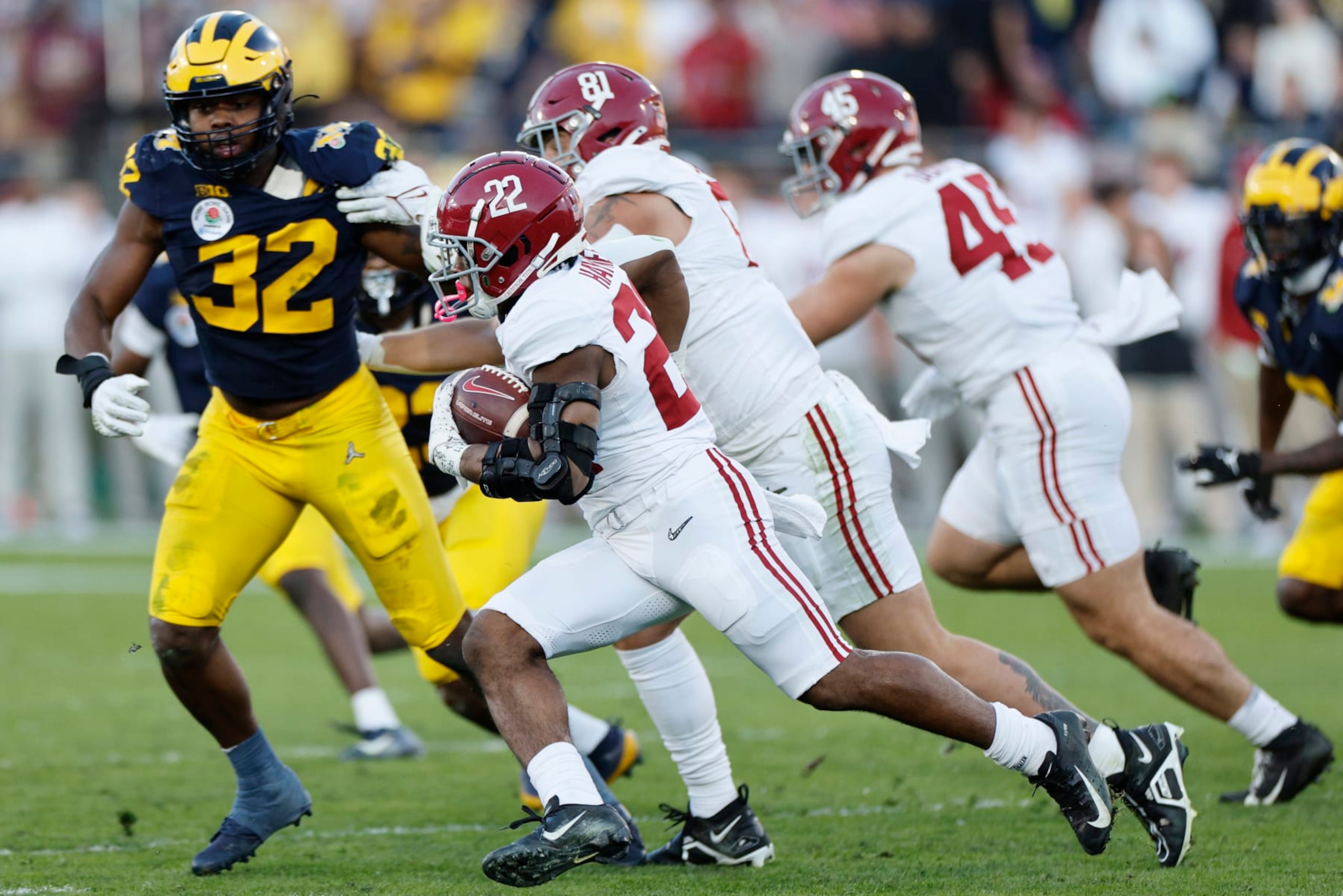 PASADENA, CALIFORNIA - JANUARY 01: Justice Haynes #22 of the Alabama Crimson Tide runs with the ball in the third quarter against the Michigan Wolverines during the CFP Semifinal Rose Bowl Game at Rose Bowl Stadium on January 01, 2024 in Pasadena, California. (Photo by Kevork Djansezian/Getty Images)