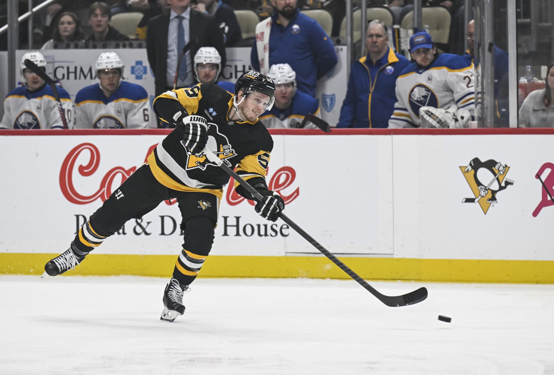 PITTSBURGH, PA - JANUARY 06: Pittsburgh Penguins left wing Jake Guentzel (59) shoots the puck during the first period in the NHL game between the Pittsburgh Penguins and the Buffalo Sabres on January 6, 2024, at PPG Paints Arena in Pittsburgh, PA. (Photo by Jeanine Leech/Icon Sportswire via Getty Images)