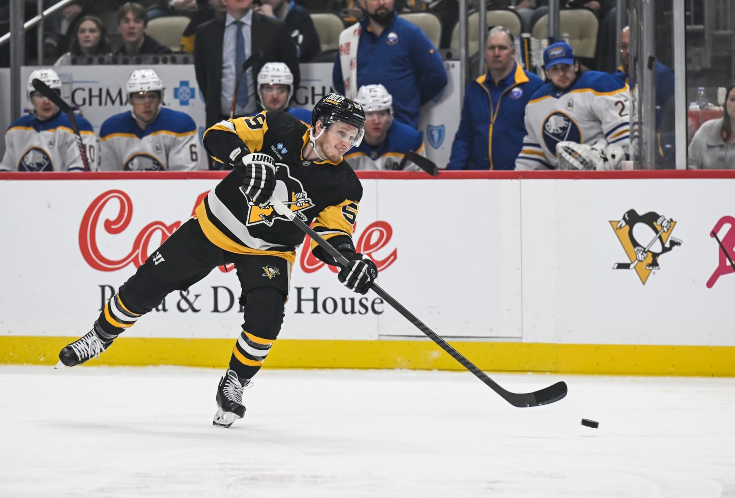 PITTSBURGH, PA - JANUARY 06: Pittsburgh Penguins left wing Jake Guentzel (59) shoots the puck during the first period in the NHL game between the Pittsburgh Penguins and the Buffalo Sabres on January 6, 2024, at PPG Paints Arena in Pittsburgh, PA. (Photo by Jeanine Leech/Icon Sportswire via Getty Images)