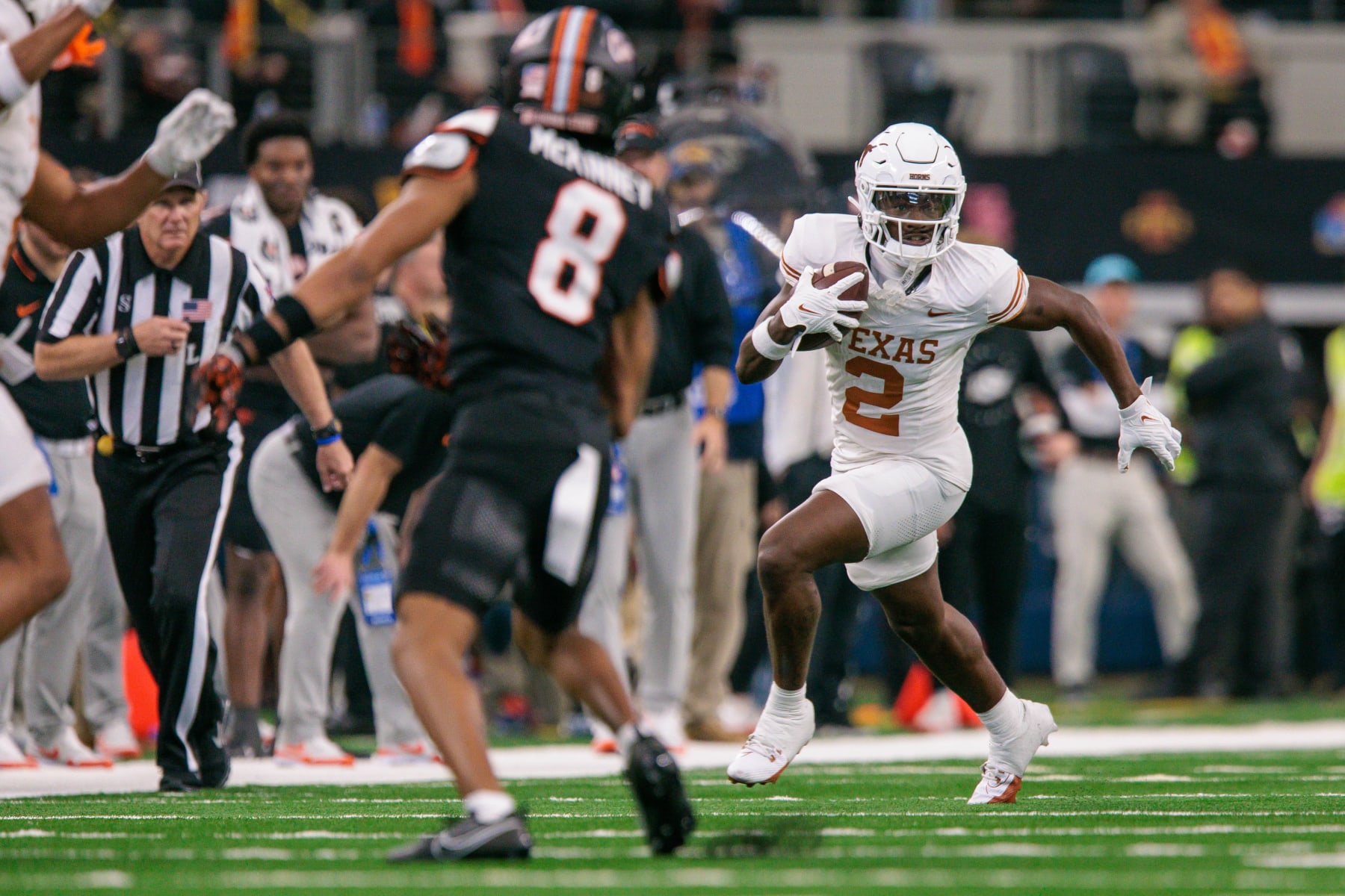 ARLINGTON, TX - DECEMBER 02: Texas Longhorns wide receiver Johntay Cook II (2) runs the ball against the Oklahoma State Cowboys at ATT Stadium in Arlington, Texas. (Photo by William Purnell/Icon Sportswire via Getty Images)