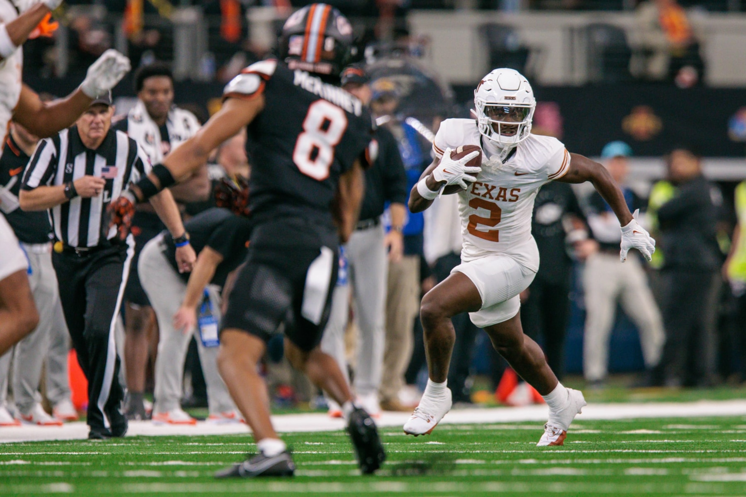 ARLINGTON, TX - DECEMBER 02: Texas Longhorns wide receiver Johntay Cook II (2) runs the ball against the Oklahoma State Cowboys at ATT Stadium in Arlington, Texas. (Photo by William Purnell/Icon Sportswire via Getty Images)