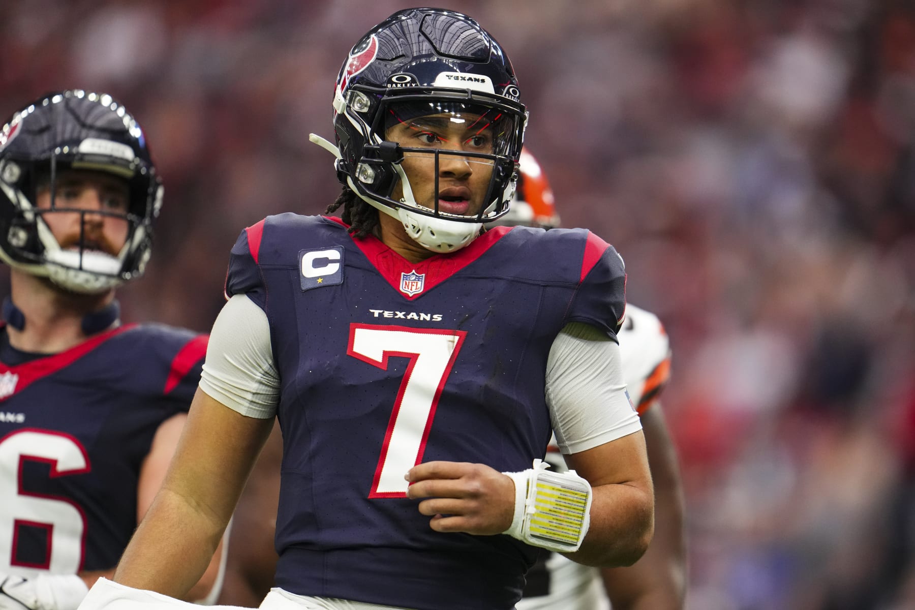 HOUSTON, TX - JANUARY 13: C.J. Stroud #7 of the Houston Texans looks on from the field during an NFL wild-card playoff football game against the Cleveland Browns at NRG Stadium on January 13, 2024 in Houston, Texas. (Photo by Cooper Neill/Getty Images)