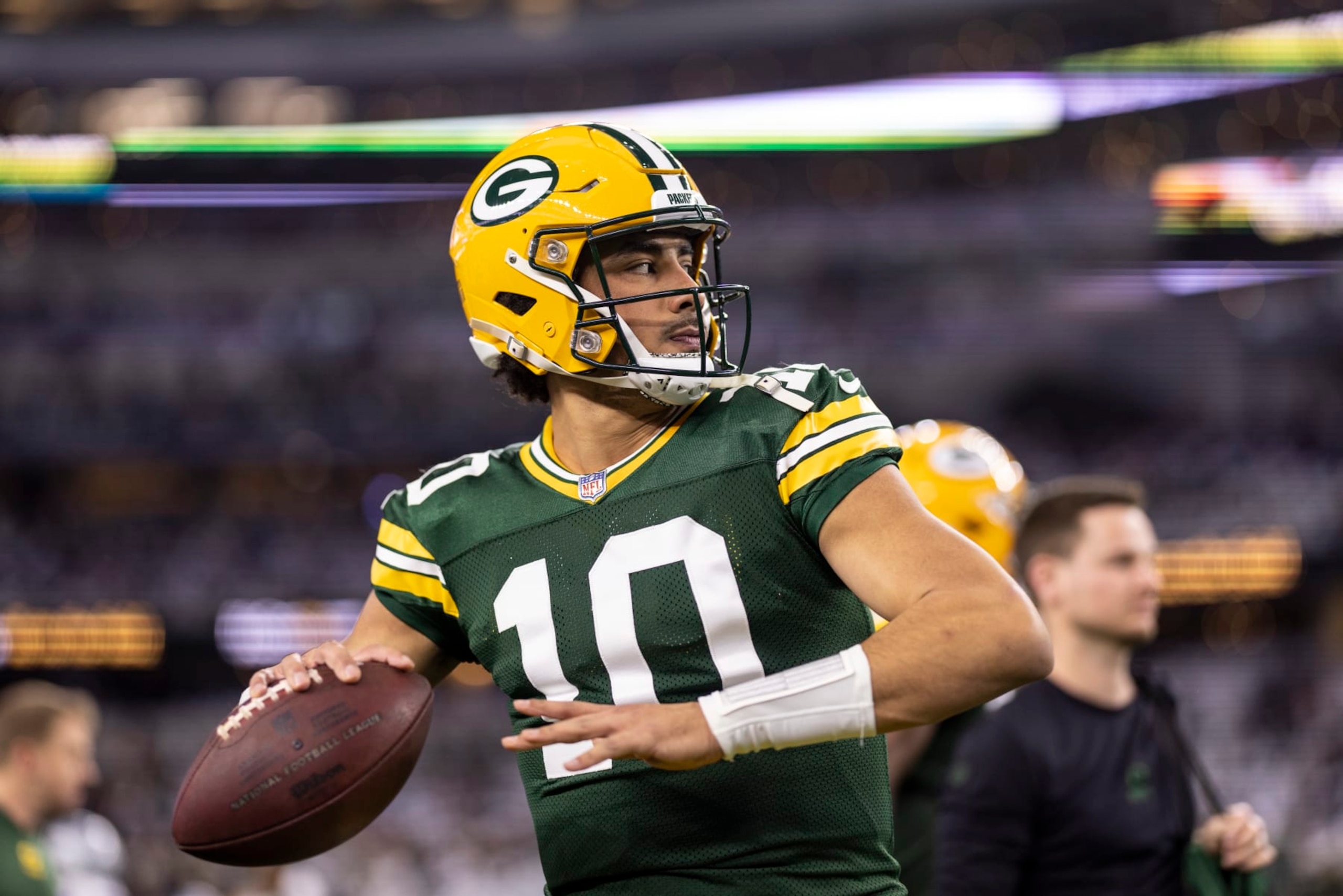 ARLINGTON, TEXAS - JANUARY 14: Jordan Love #10 of the Green Bay Packers looks to pass as he warms up prior to an NFL wild-card playoff football game between the Dallas Cowboys and the Green Bay Packers at AT&T Stadium on January 14, 2024 in Arlington, Texas. (Photo by Michael Owens/Getty Images)