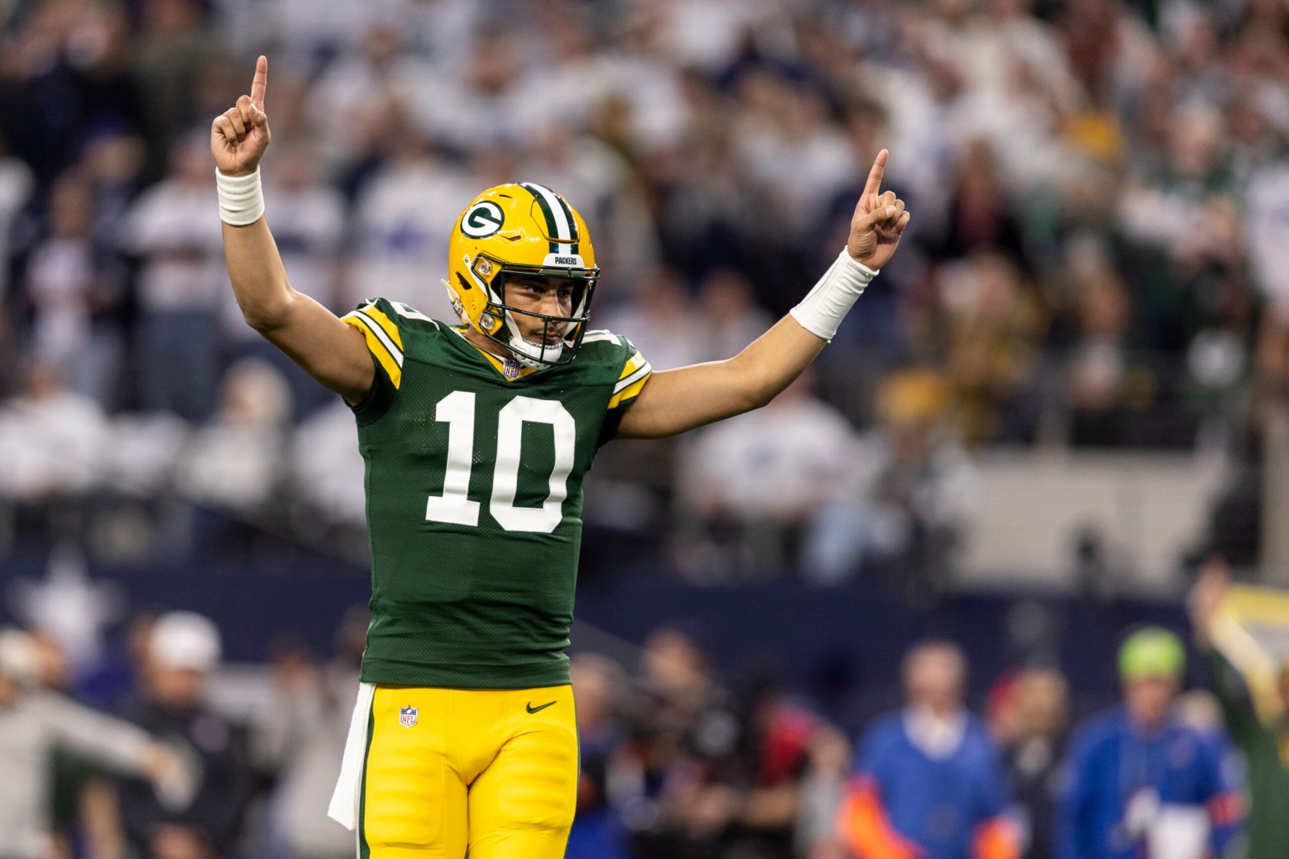ARLINGTON, TEXAS - JANUARY 14: Jordan Love #10 of the Green Bay Packers celebrates after a touchdown during an NFL wild-card playoff football game between the Dallas Cowboys and the Green Bay Packers at AT&T Stadium on January 14, 2024 in Arlington, Texas. (Photo by Michael Owens/Getty Images)
