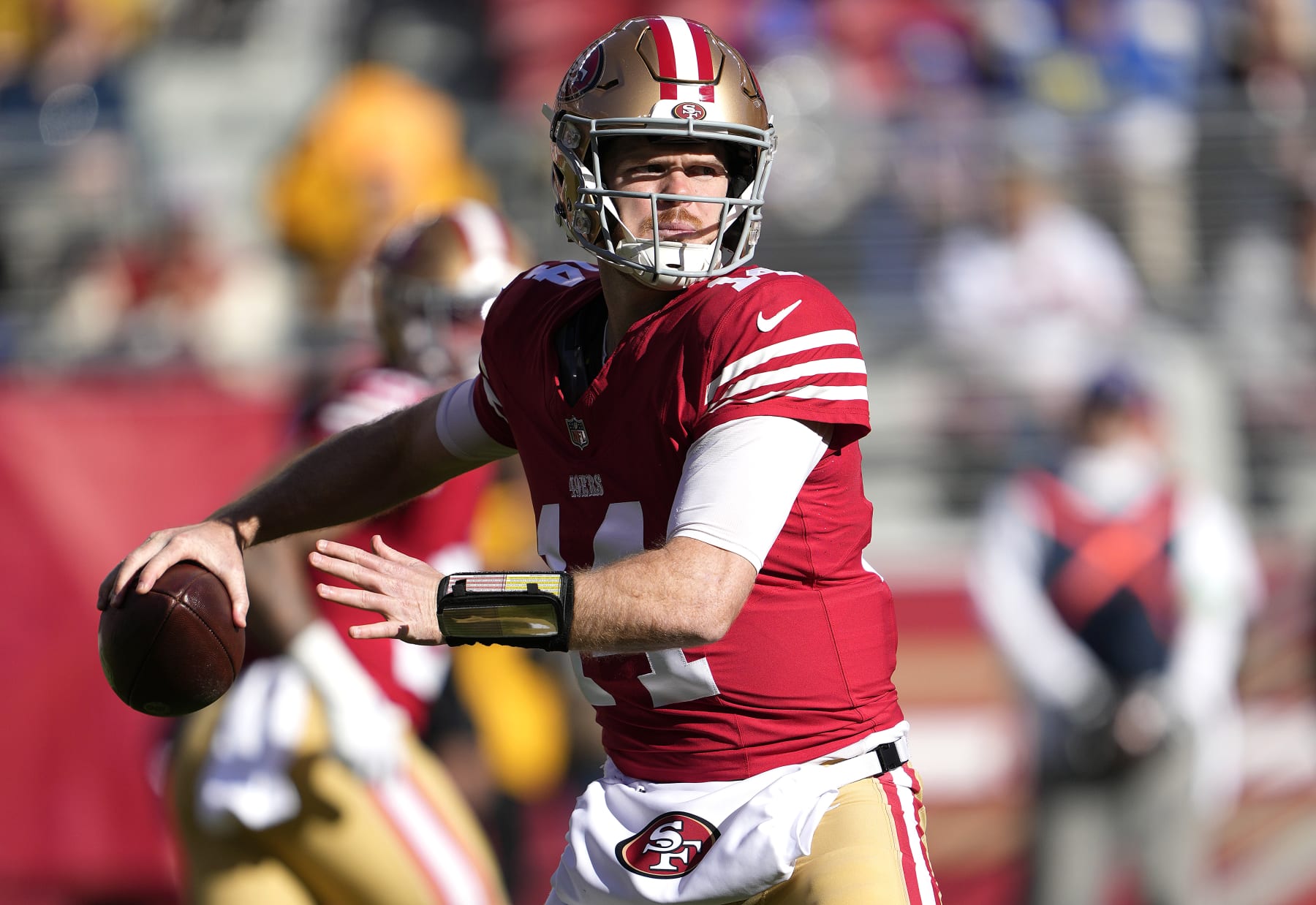 SANTA CLARA, CALIFORNIA - JANUARY 07: Sam Darnold #14 of the San Francisco 49ers drops back looking to pass against the Los Angeles Rams during the first quarter of an NFL football game at Levi's Stadium on January 07, 2024 in Santa Clara, California. (Photo by Thearon W. Henderson/Getty Images)