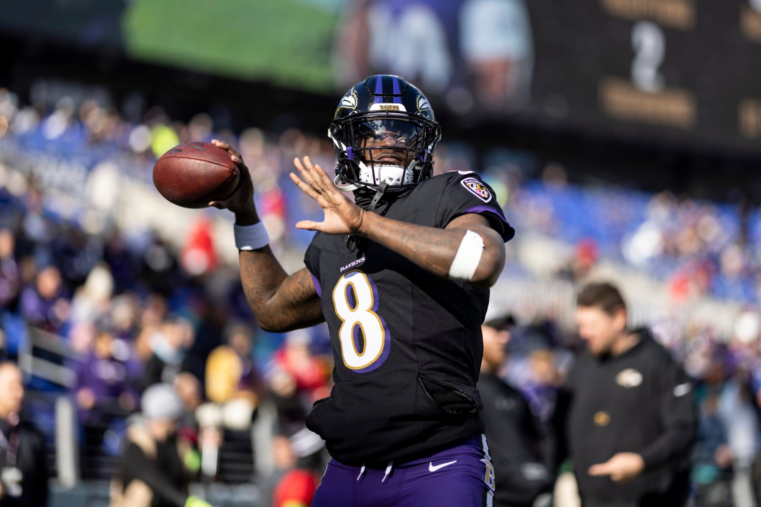 BALTIMORE, MARYLAND - DECEMBER 31: Lamar Jackson #8 of the Baltimore Ravens looks to pass as he warms up prior to an NFL football game between the Baltimore Ravens and the Miami Dolphins at M&T Bank Stadium on December 31, 2023 in Baltimore, Maryland. (Photo by Michael Owens/Getty Images)