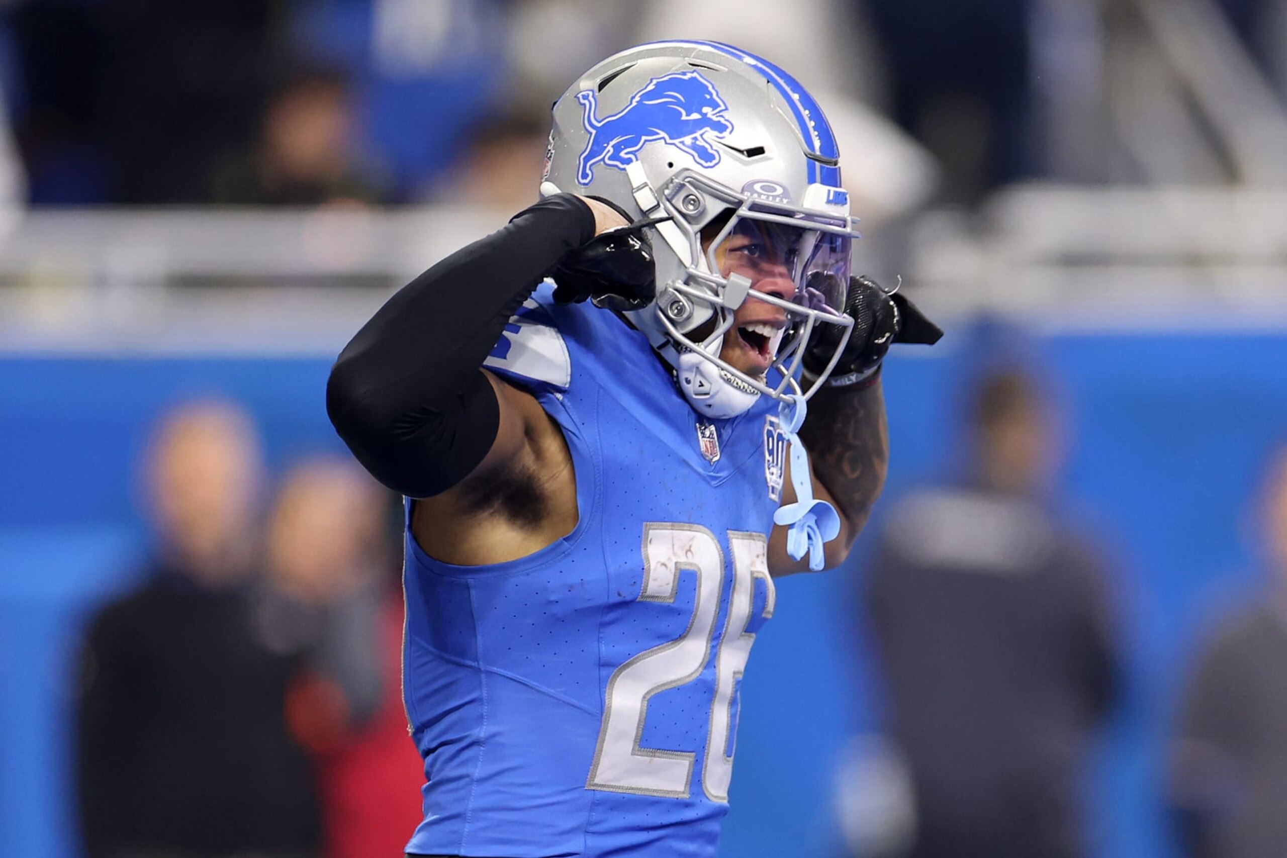 DETROIT, MICHIGAN - JANUARY 14: Jahmyr Gibbs #26 of the Detroit Lions celebrates after scoring a touchdown during the first quarter against the Los Angeles Rams in the NFC Wild Card Playoffs at Ford Field on January 14, 2024 in Detroit, Michigan. (Photo by Gregory Shamus/Getty Images)
