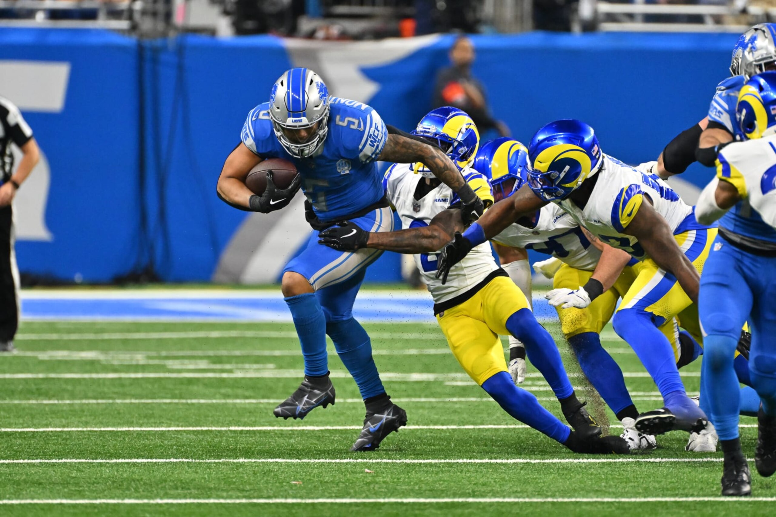 DETROIT, MI - JANUARY 14: Detroit Lions running back David Montgomery (5) breaks a tackle for a good gain during the NFC Wild Card game between the Detroit Lions and the Los Angeles Rams game on Sunday January 14, 2023 at Ford Field in Detroit, MI. (Photo by Steven King/Icon Sportswire via Getty Images)