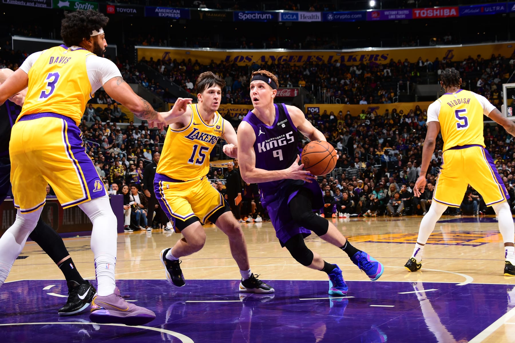 LOS ANGELES, CA - NOVEMBER 15: Kevin Huerter #9 of the Sacramento Kings drives to the basket during the game against the Los Angeles Lakers on November 15, 2023 at Crypto.Com Arena in Los Angeles, California. NOTE TO USER: User expressly acknowledges and agrees that, by downloading and/or using this Photograph, user is consenting to the terms and conditions of the Getty Images License Agreement. Mandatory Copyright Notice: Copyright 2023 NBAE (Photo by Adam Pantozzi/NBAE via Getty Images)
