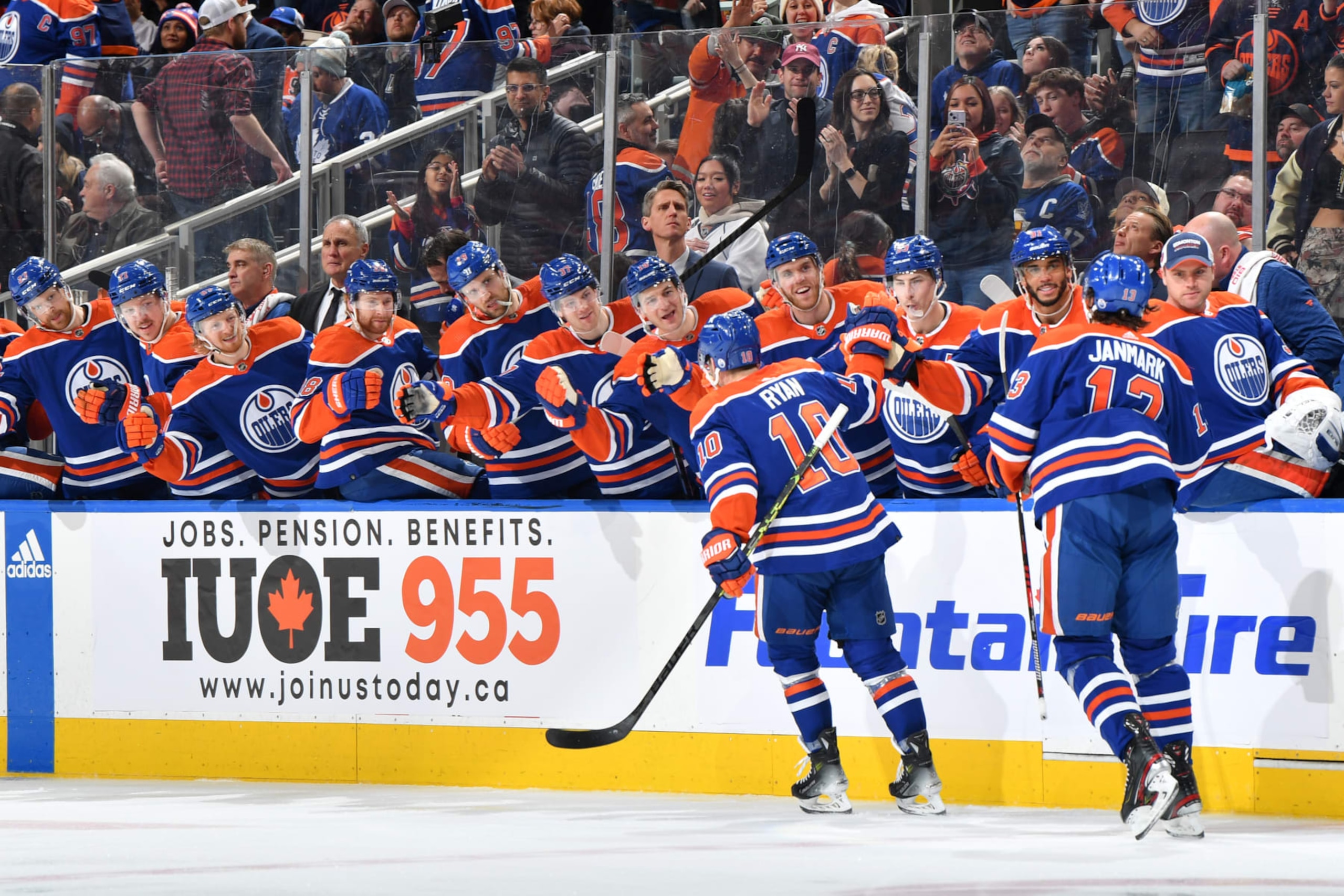 EDMONTON, CANADA - JANUARY 16: Derek Ryan #10 of the Edmonton Oilers celebrates his third period goal against the Toronto Maple Leafs with Mattias Janmark #13 at the bench at Rogers Place on January 16, 2024, in Edmonton, Alberta, Canada. (Photo by Andy Devlin/NHLI via Getty Images)