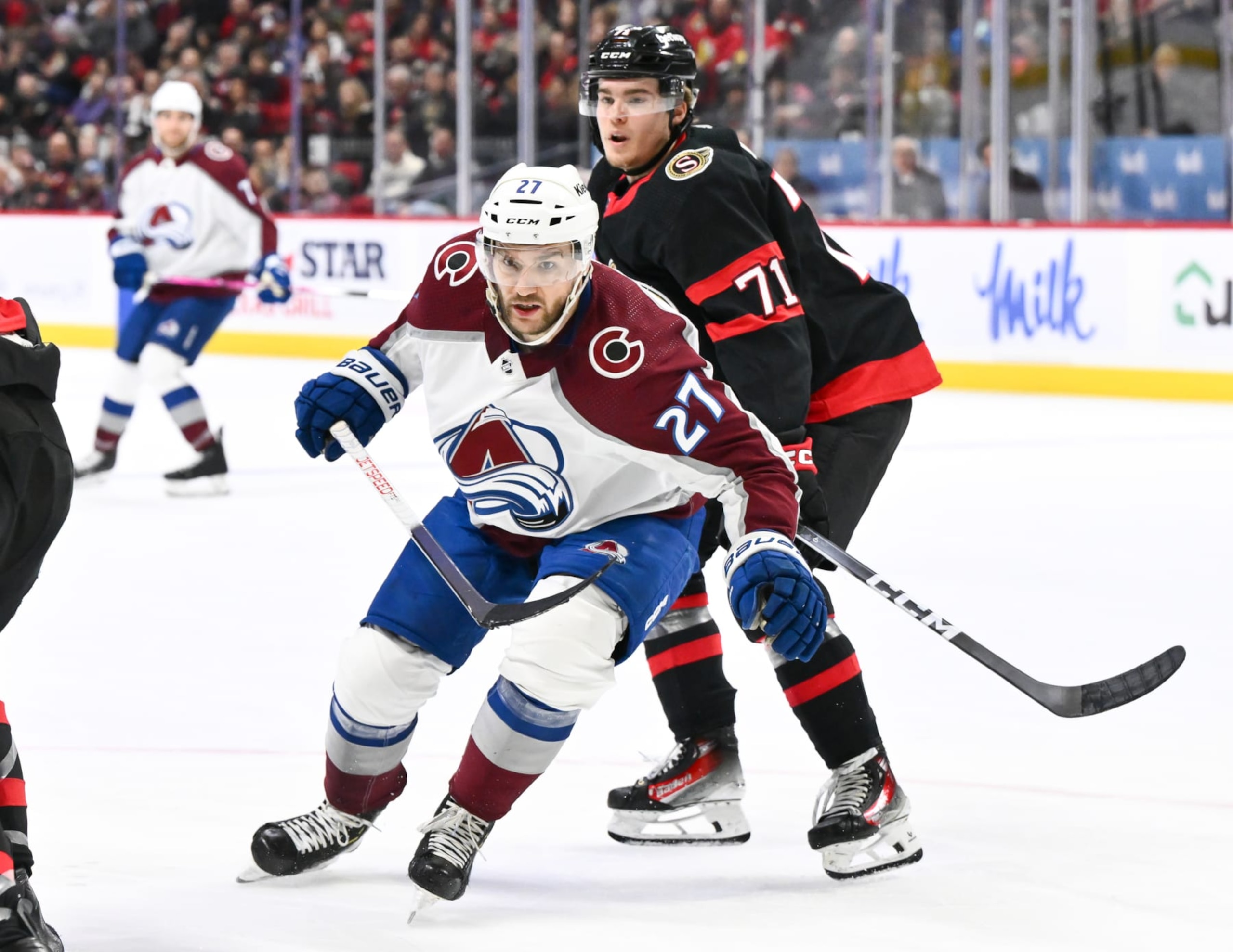 OTTAWA, CANADA - JANUARY 16:  Jonathan Drouin #27 of the Colorado Avalanche and Ridly Greig #71 of the Ottawa Senators skate against each other during the first period at Canadian Tire Centre on January 16, 2024 in Ottawa, Ontario, Canada.  The Colorado Avalanche defeated the Ottawa Senators 7-4.  (Photo by Minas Panagiotakis/Getty Images)