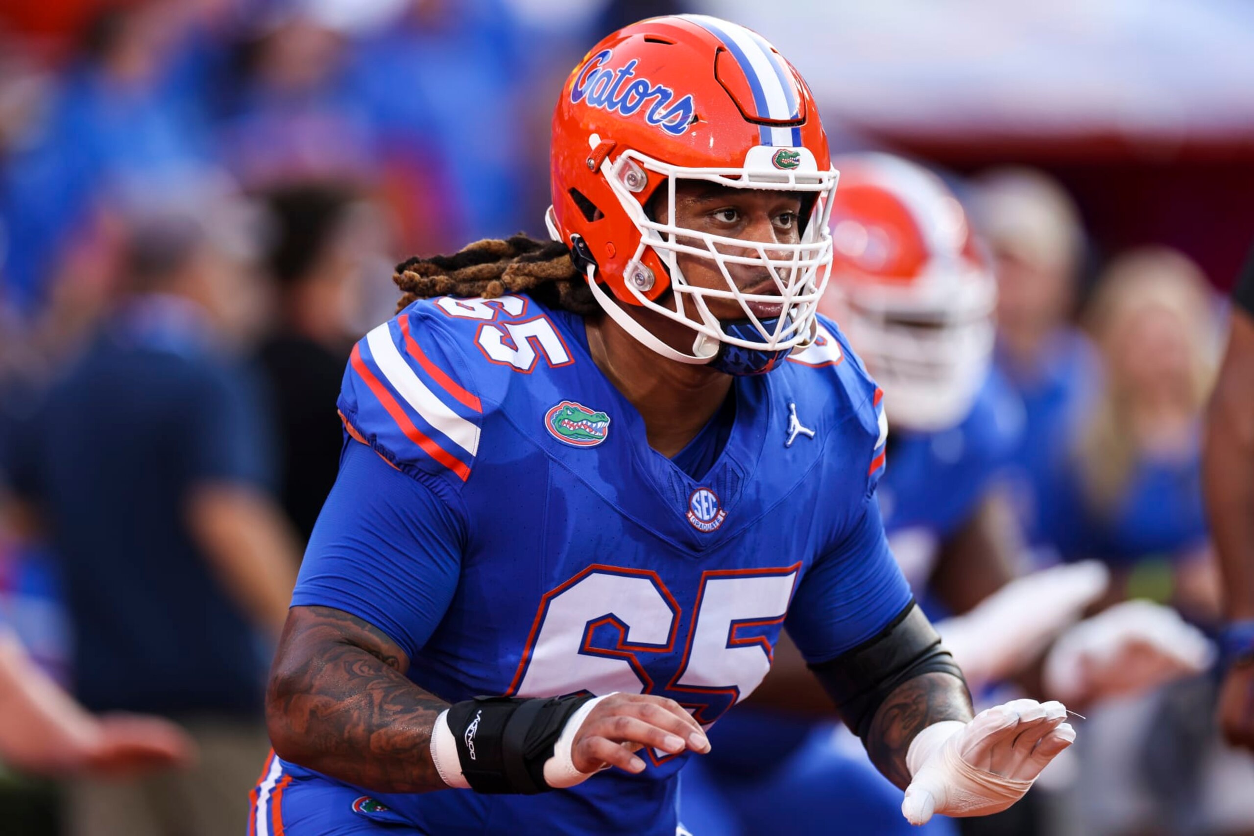 GAINESVILLE, FLORIDA - SEPTEMBER 16: Kingsley Eguakun #65 of the Florida Gators looks on before the start of a game against the Tennessee Volunteers at Ben Hill Griffin Stadium on September 16, 2023 in Gainesville, Florida. (Photo by James Gilbert/Getty Images) GAINESVILLE, FLORIDA - SEPTEMBER 16: Kingsley Eguakun #65 of the Florida Gators looks on before the start of a game against the Tennessee Volunteers at Ben Hill Griffin Stadium on September 16, 2023 in Gainesville, Florida. (Photo by James Gilbert/Getty Images)
