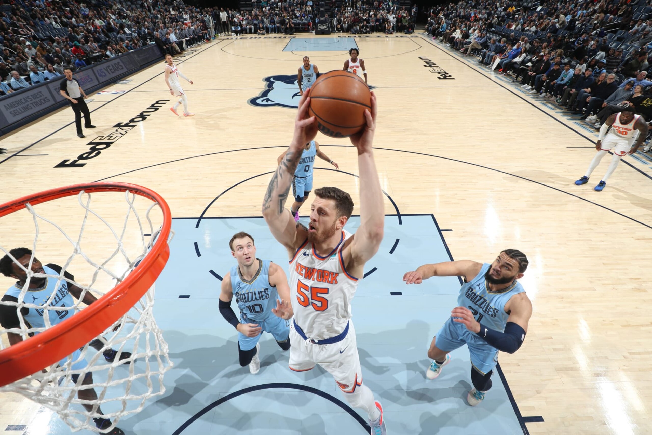 MEMPHIS, TN - JANUARY 13: Isaiah Hartenstein #55 of the New York Knicks drives to the basket during the game against the Memphis Grizzlies on January 13, 2024 at FedExForum in Memphis, Tennessee. NOTE TO USER: User expressly acknowledges and agrees that, by downloading and or using this photograph, User is consenting to the terms and conditions of the Getty Images License Agreement. Mandatory Copyright Notice: Copyright 2024 NBAE (Photo by Joe Murphy/NBAE via Getty Images)
