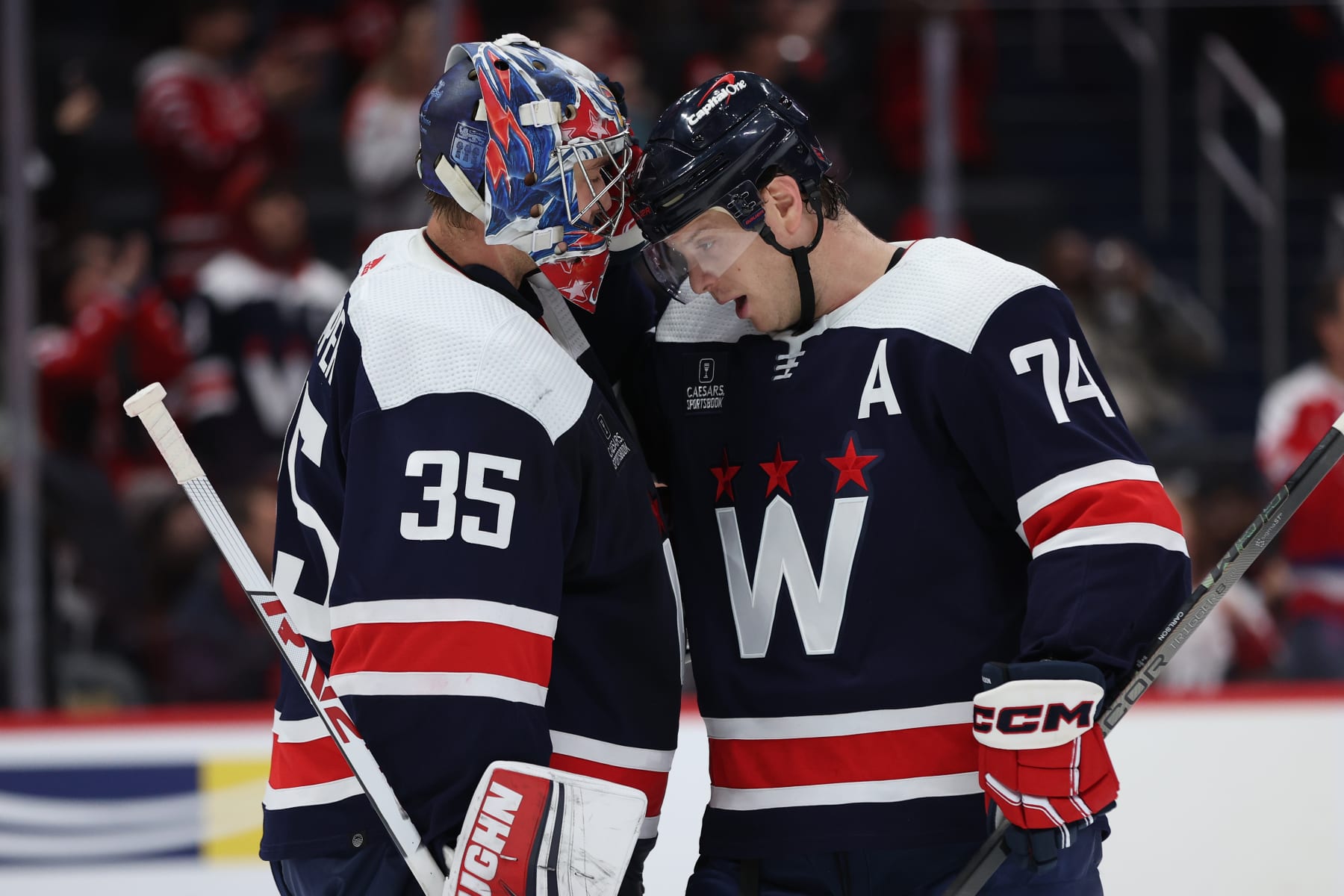 WASHINGTON, DC - JANUARY 16: Goalie Darcy Kuemper #35 and John Carlson #74 of the Washington Capitals celebrate after defeating the Anaheim Ducks at Capital One Arena on January 16, 2024 in Washington, DC. (Photo by Patrick Smith/Getty Images)