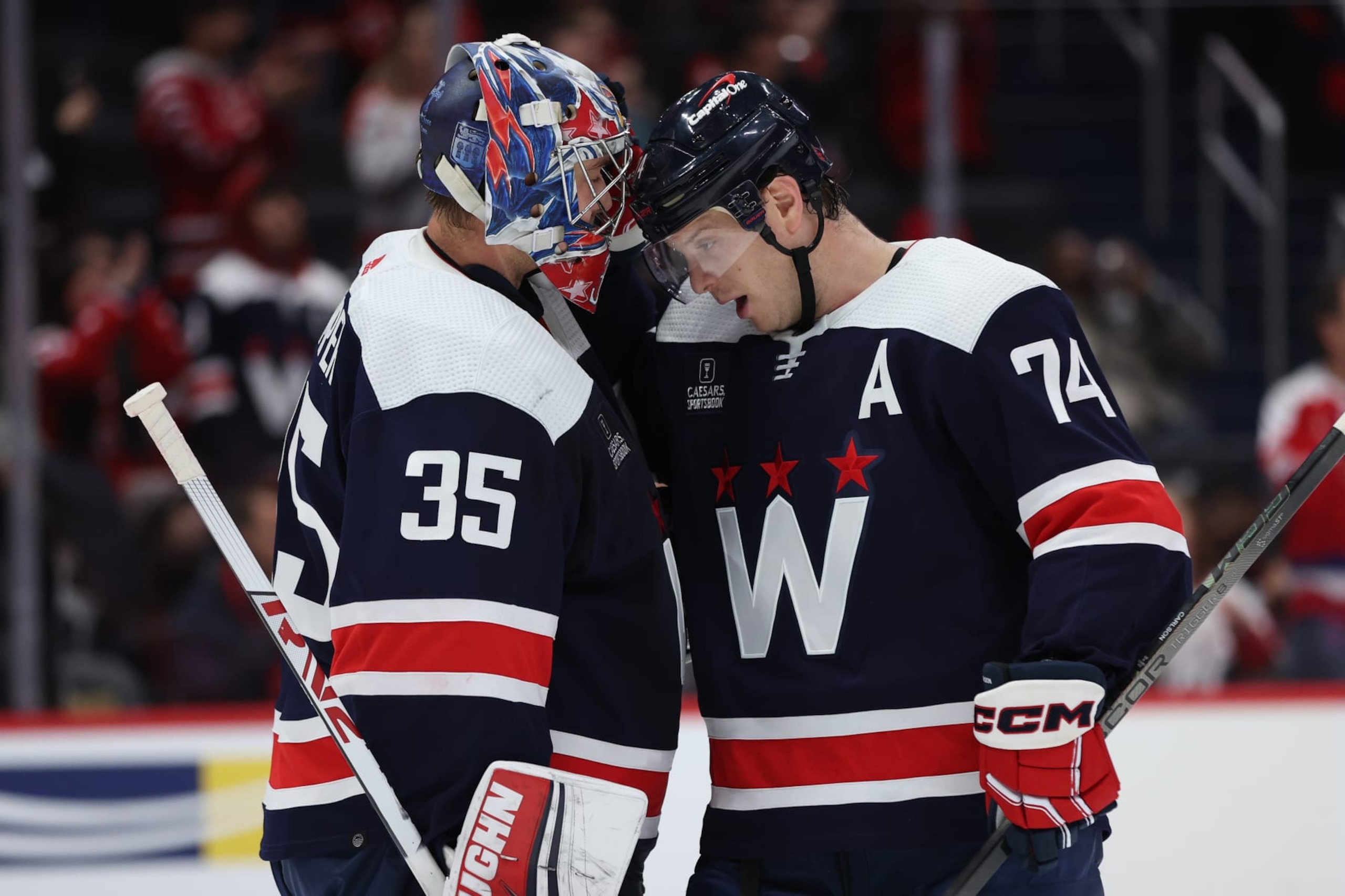 WASHINGTON, DC - JANUARY 16: Goalie Darcy Kuemper #35 and John Carlson #74 of the Washington Capitals celebrate after defeating the Anaheim Ducks at Capital One Arena on January 16, 2024 in Washington, DC. (Photo by Patrick Smith/Getty Images)