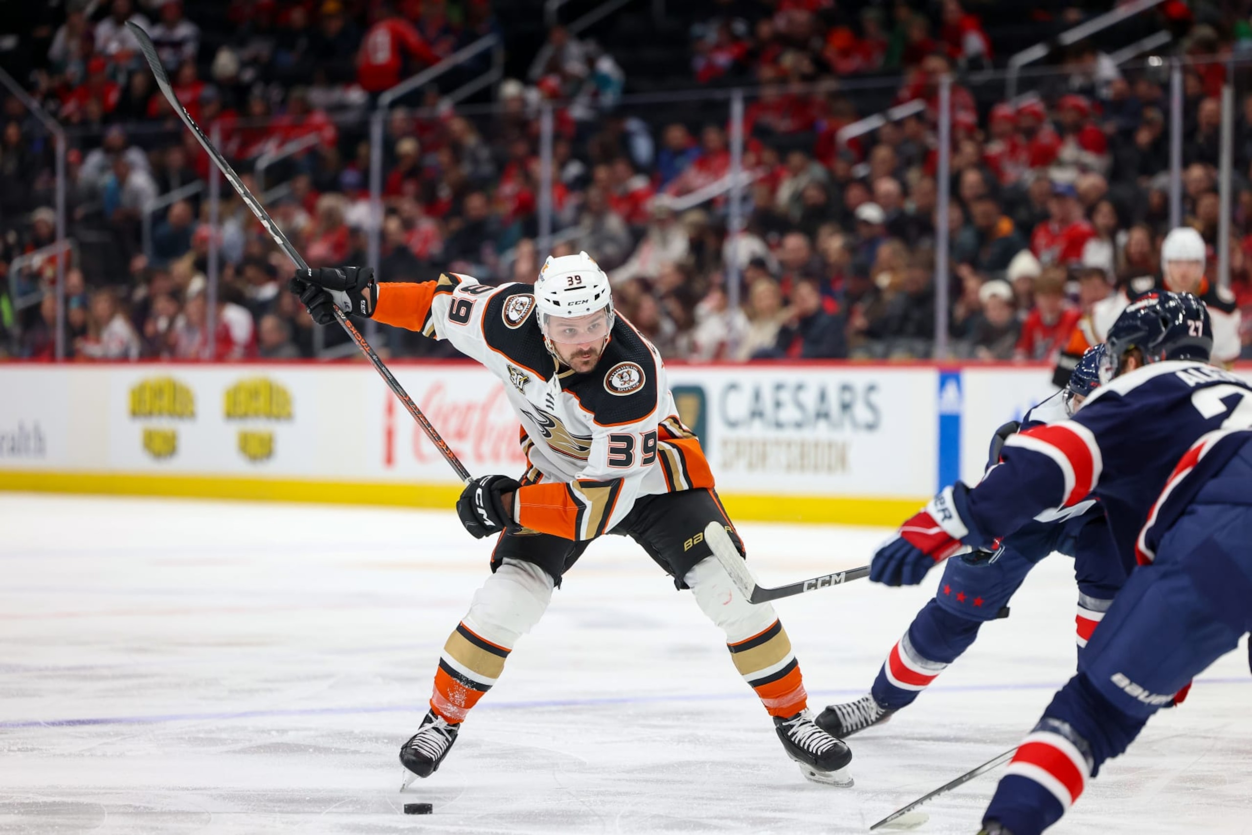 WASHINGTON, DC - JANUARY 16: Sam Carrick #39 of the Anaheim Ducks looks tot are a shot on goal during a game against the Washington Capitals at Capital One Arena on January 16, 2024 in Washington, D.C. (Photo by John McCreary/NHLI via Getty Images)