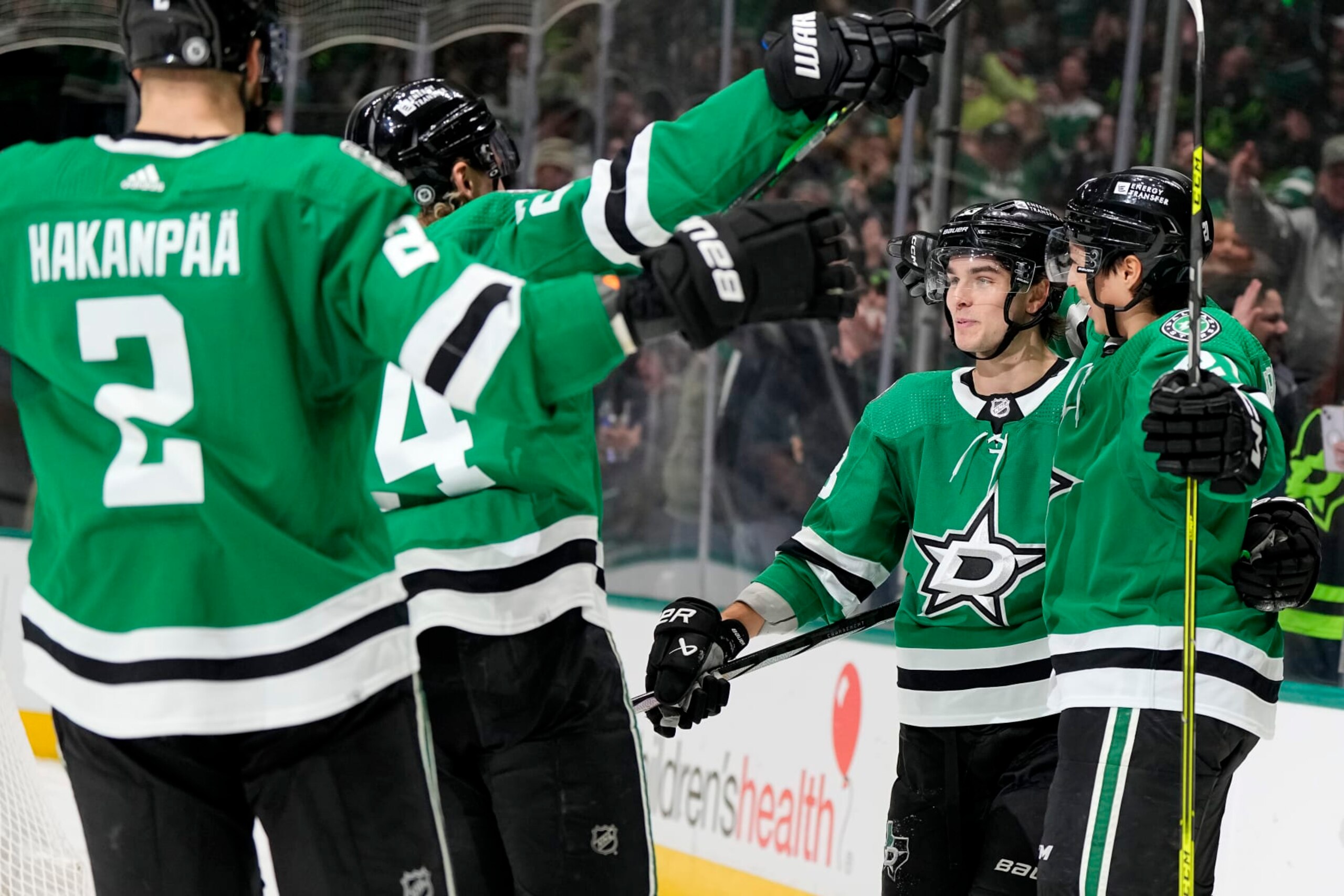 DALLAS, TEXAS - JANUARY 16: Wyatt Johnston (right center) #53 of the Dallas Stars celebrates his third period goal against the Los Angeles Kings with Jani Hakanpaa #2, Roope Hintz #24, and Jason Robertson #21 at American Airlines Center on January 16, 2024 in Dallas, Texas. (Photo by Sam Hodde/Getty Images)