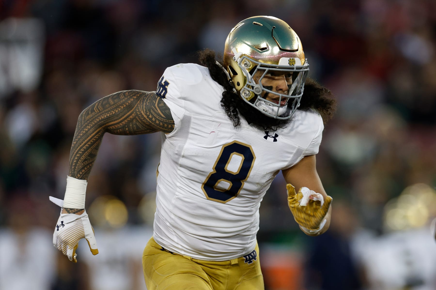 STANFORD, CALIFORNIA - NOVEMBER 25: Marist Liufau #8 of the Notre Dame Fighting Irish runs in the second half during a game against the Stanford Cardinal at Stanford Stadium on November 25, 2023 in Stanford, California. (Photo by Brandon Sloter/Image Of Sport/Getty Images)