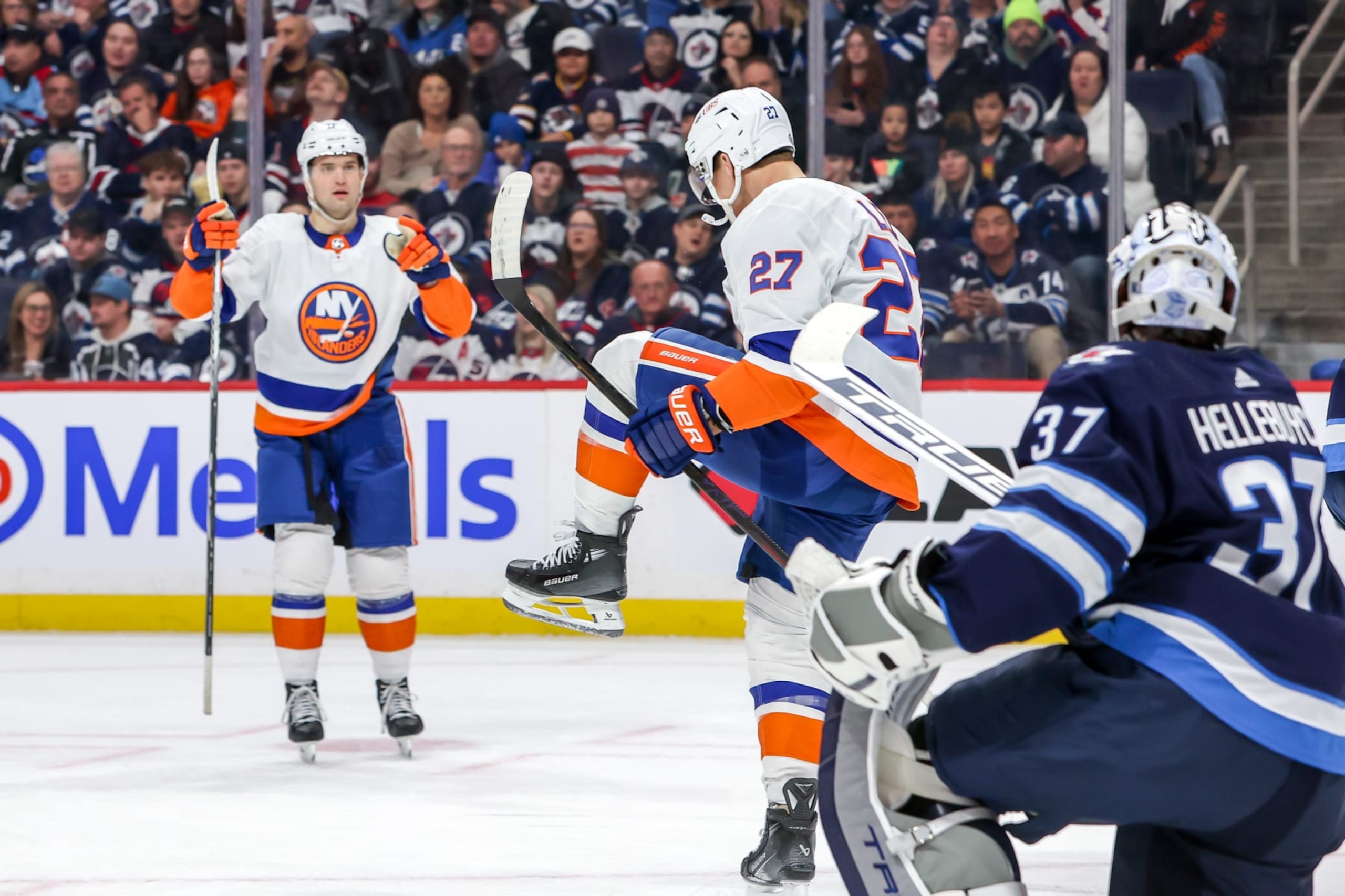 WINNIPEG, CANADA - JANUARY 16: Anders Lee #27 of the New York Islanders celebrates after scoring a first period goal against the Winnipeg Jets at the Canada Life Centre on January 16, 2024 in Winnipeg, Manitoba, Canada. (Photo by Jonathan Kozub/NHLI via Getty Images)