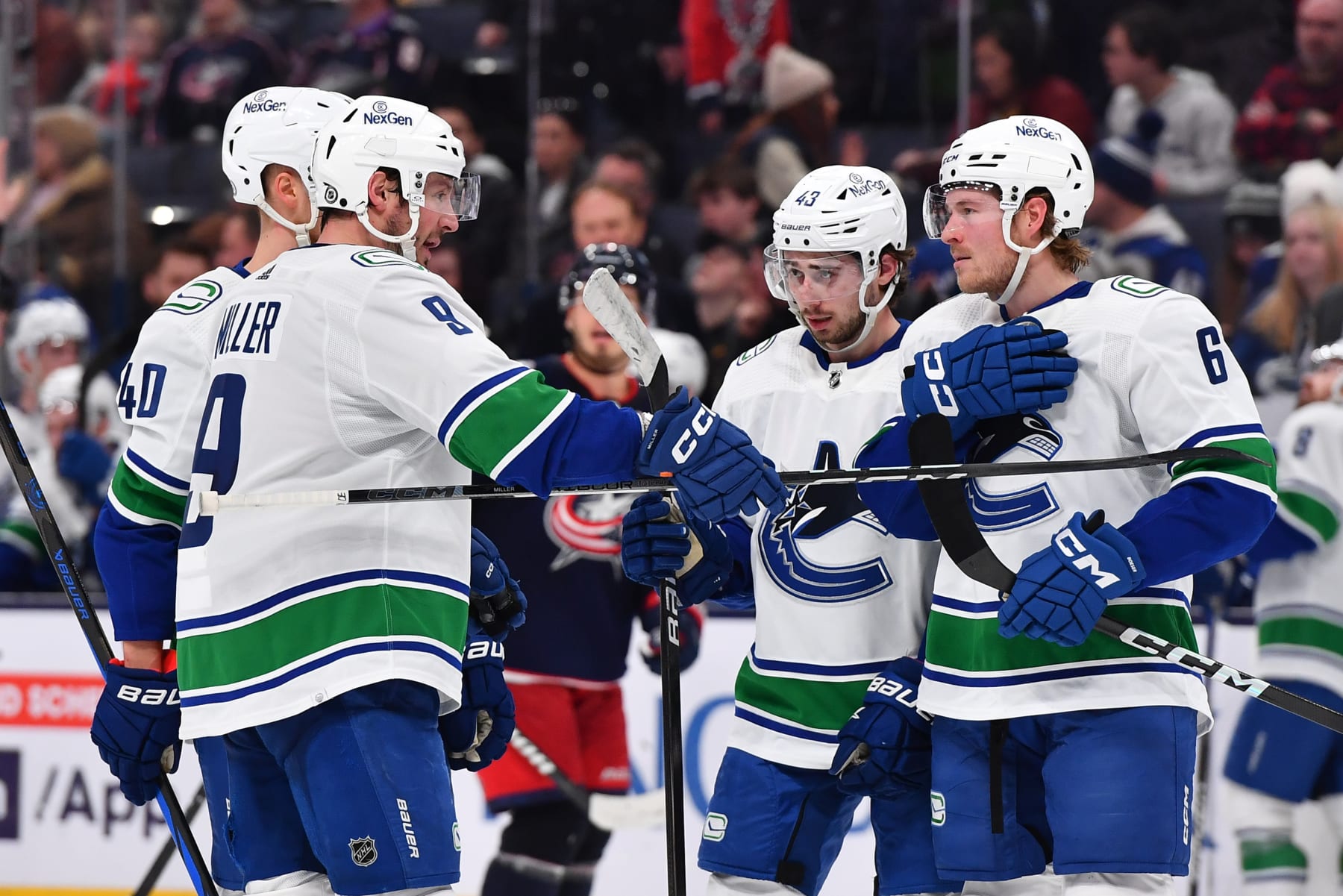 COLUMBUS, OHIO - JANUARY 15: J.T. Miller #9 of the Vancouver Canucks talks with his teammates during the overtime period of a game against the Columbus Blue Jackets at Nationwide Arena on January 15, 2024 in Columbus, Ohio. (Photo by Ben Jackson/NHLI via Getty Images)
