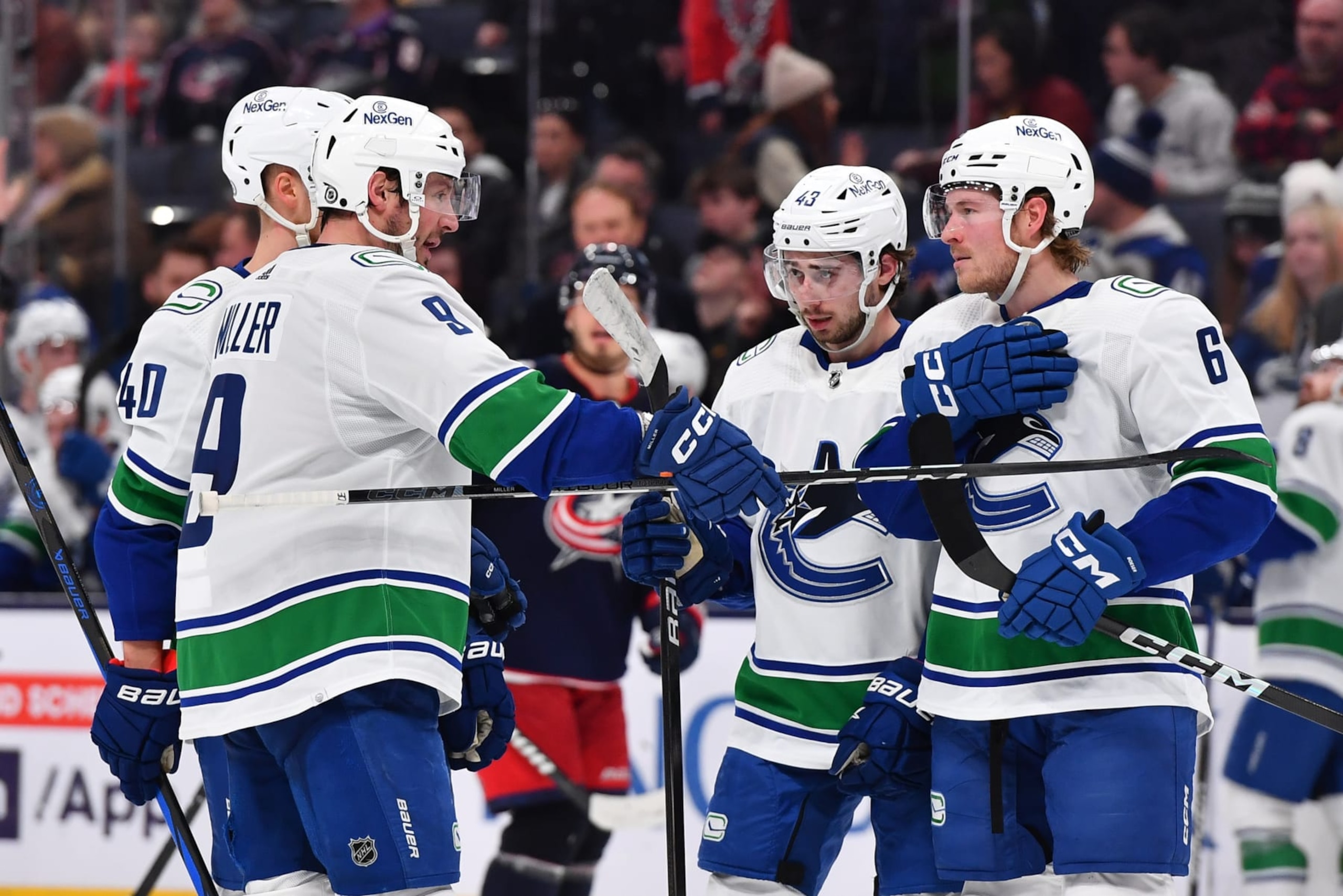 COLUMBUS, OHIO - JANUARY 15: J.T. Miller #9 of the Vancouver Canucks talks with his teammates during the overtime period of a game against the Columbus Blue Jackets at Nationwide Arena on January 15, 2024 in Columbus, Ohio. (Photo by Ben Jackson/NHLI via Getty Images)