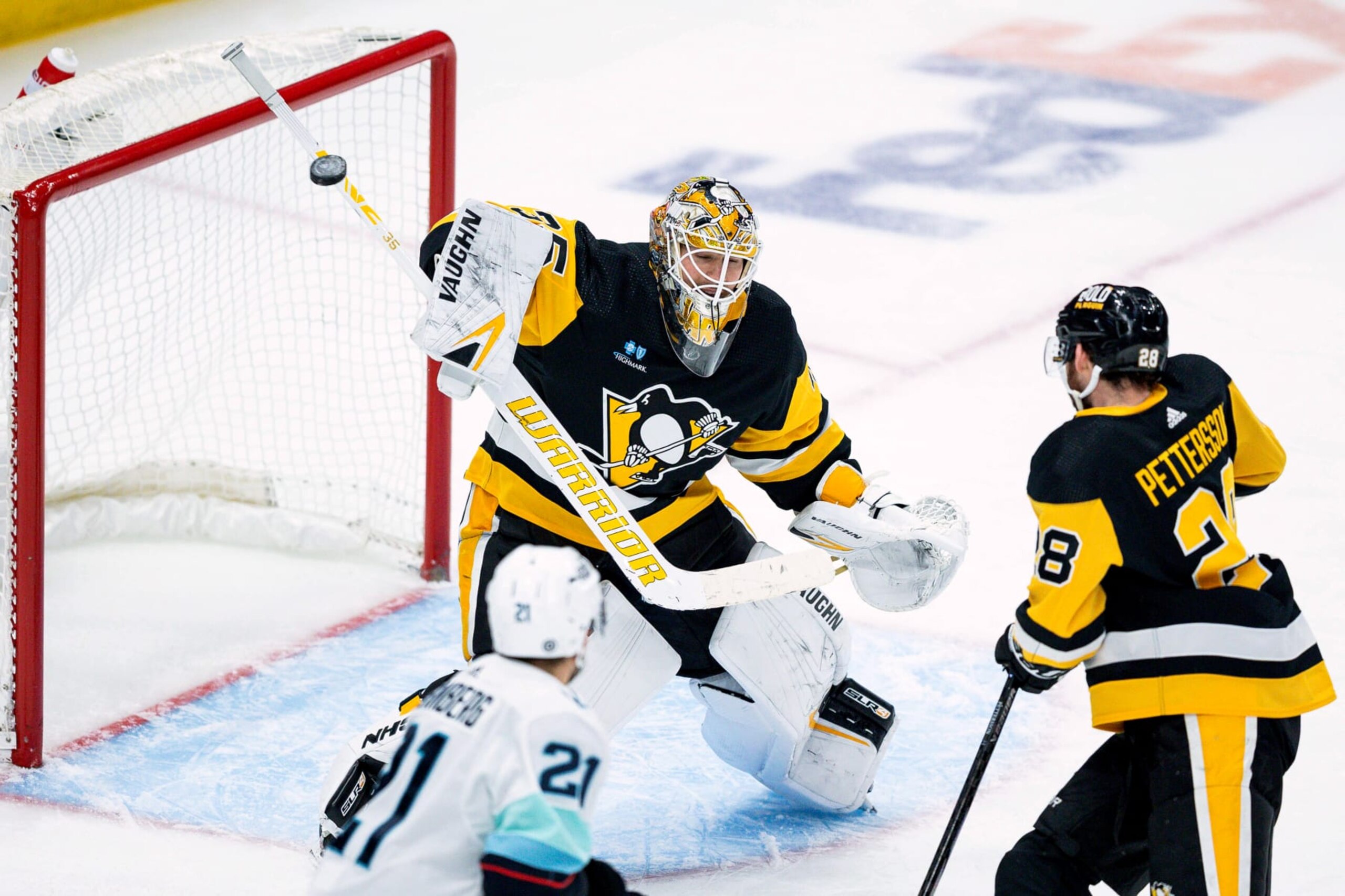 PITTSBURGH, PENNSYLVANIA - JANUARY 15: Tristan Jarry #35 of the Pittsburgh Penguins deflects a shot on goal during the third period against the Seattle Kraken at PPG PAINTS Arena on January 15, 2024 in Pittsburgh, Pennsylvania. (Photo by Harrison Barden/Getty Images)