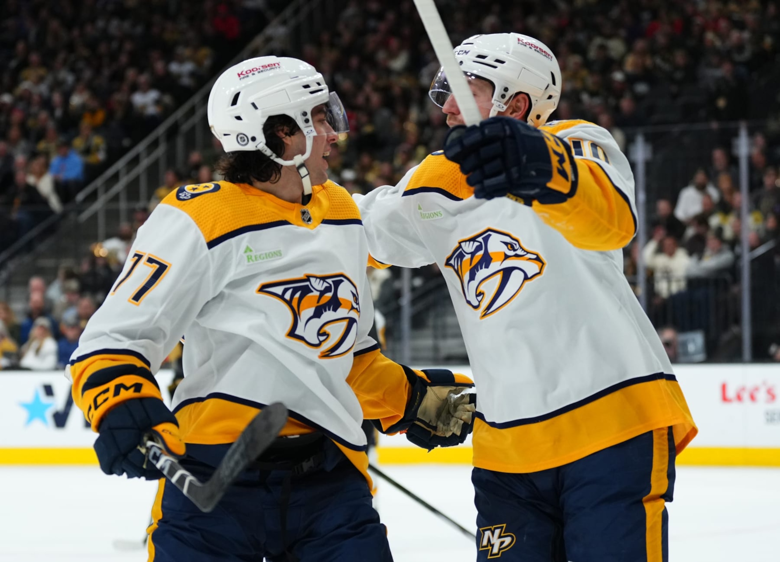 LAS VEGAS, NEVADA - JANUARY 15: Luke Evangelista #77 of the Nashville Predators celebrates with teammates after a goal during the second period against the Vegas Golden Knights at T-Mobile Arena on January 15, 2024 in Las Vegas, Nevada. (Photo by Jeff Bottari/NHLI via Getty Images)