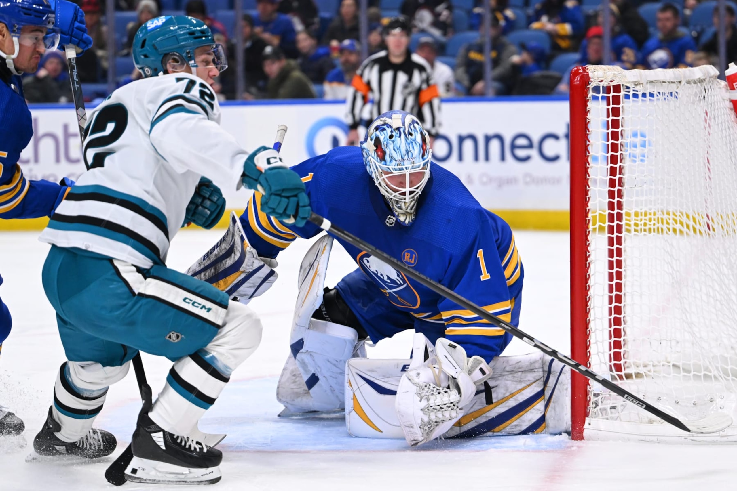 BUFFALO, NEW YORK - JANUARY 15: Ukko-Pekka Luukkonen #1 of the Buffalo Sabres tends goal against William Eklund #72 of the San Jose Sharks during an NHL game on January 15, 2024 at KeyBank Center in Buffalo, New York. (Photo by Joe Hrycych/NHLI via Getty Images)